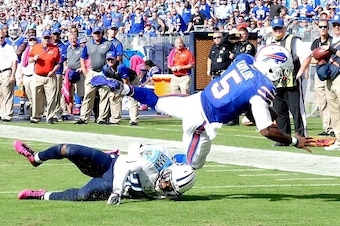 NASHVILLE, TN - OCTOBER 11: Quarterback Tyrod Taylor #5 of the Buffalo Bills dives for additional yardage against Perrish Cox #29 of the Tennessee Titans during the second half of a game at Nissan Stadium on October 11, 2015 in Nashville, Tennessee. (Phot