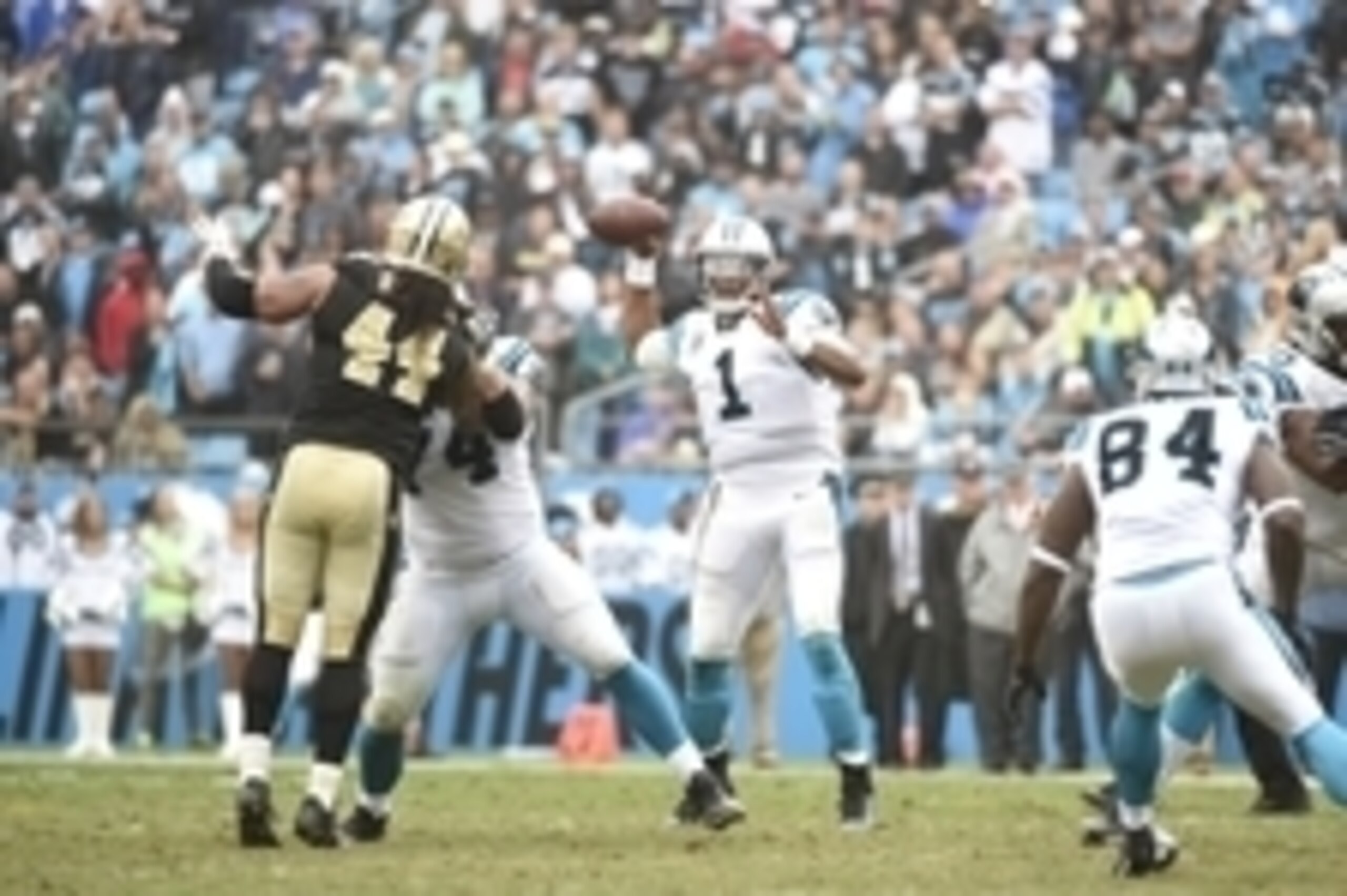 Sep 27, 2015; Charlotte, NC, USA; Carolina Panthers quarterback Cam Newton (1) looks to pass as New Orleans Saints outside linebacker Hau'oli Kikaha (44) pressures in the fourth quarter. The Panthers defeated the Saints 27-22 at Bank of America Stadium. M