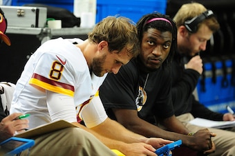 ATLANTA, GA - OCTOBER 11: Kirk Cousins #8 and Robert Griffin III of the Washington Redskins go over game notes during the game against the Atlanta Falcons at the Georgia Dome on October 11, 2015 in Atlanta, Georgia. (Photo by Scott Cunningham/Getty Images