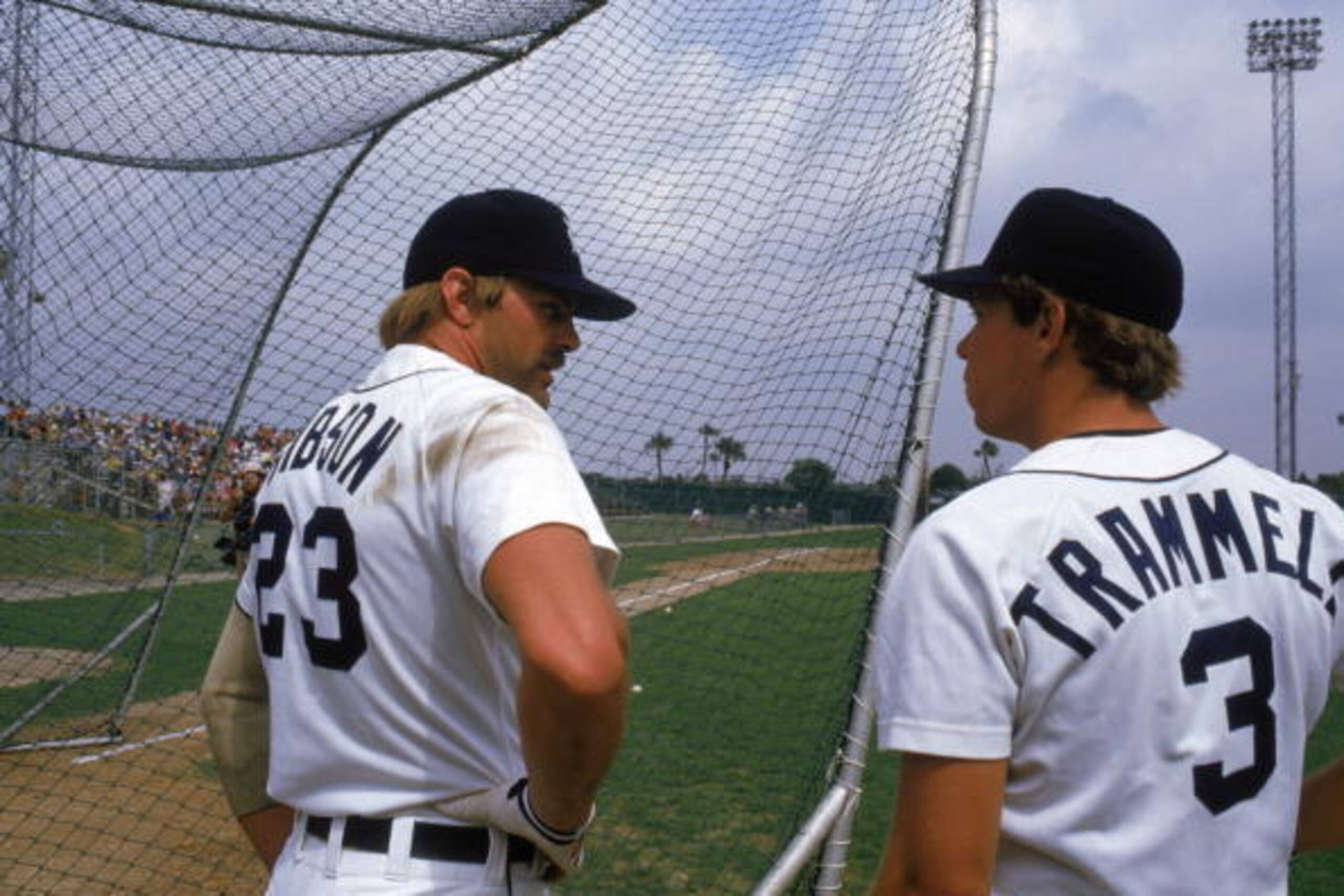 MARCH - 1985:  Kirk Gibson #23 of the Detroit Tigers talks with teammate Alan Trammell #3 as they stand outside the batting cage during spring training in March of 1985.  (Photo by Andrew D. Bernstein/Getty Images)