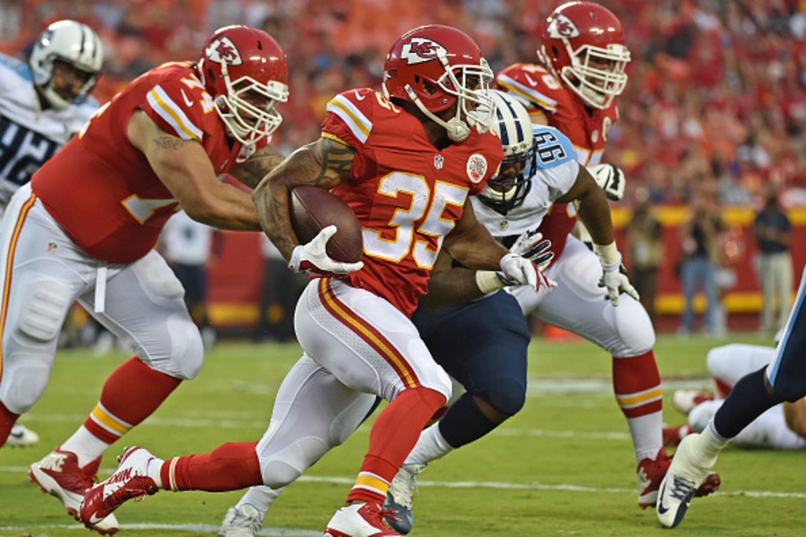 KANSAS CITY, MO - AUGUST 28:  Running back Charcandrick West #35 of the Kansas City Chiefs runs up field against the Tennessee Titans during the first half of a preseason game at Arrowhead Stadium on August 28, 2015 in Kansas City, Missouri.  (Photo by Pe