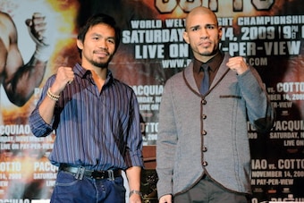 LAS VEGAS - NOVEMBER 11:  Boxer Manny Pacquiao (L) and WBO welterweight champion Miguel Cotto pose during the final news conference for their bout at the MGM Grand Hotel/Casino November 11, 2009 in Las Vegas, Nevada. Pacquiao and Cotto will meet in a WBO 