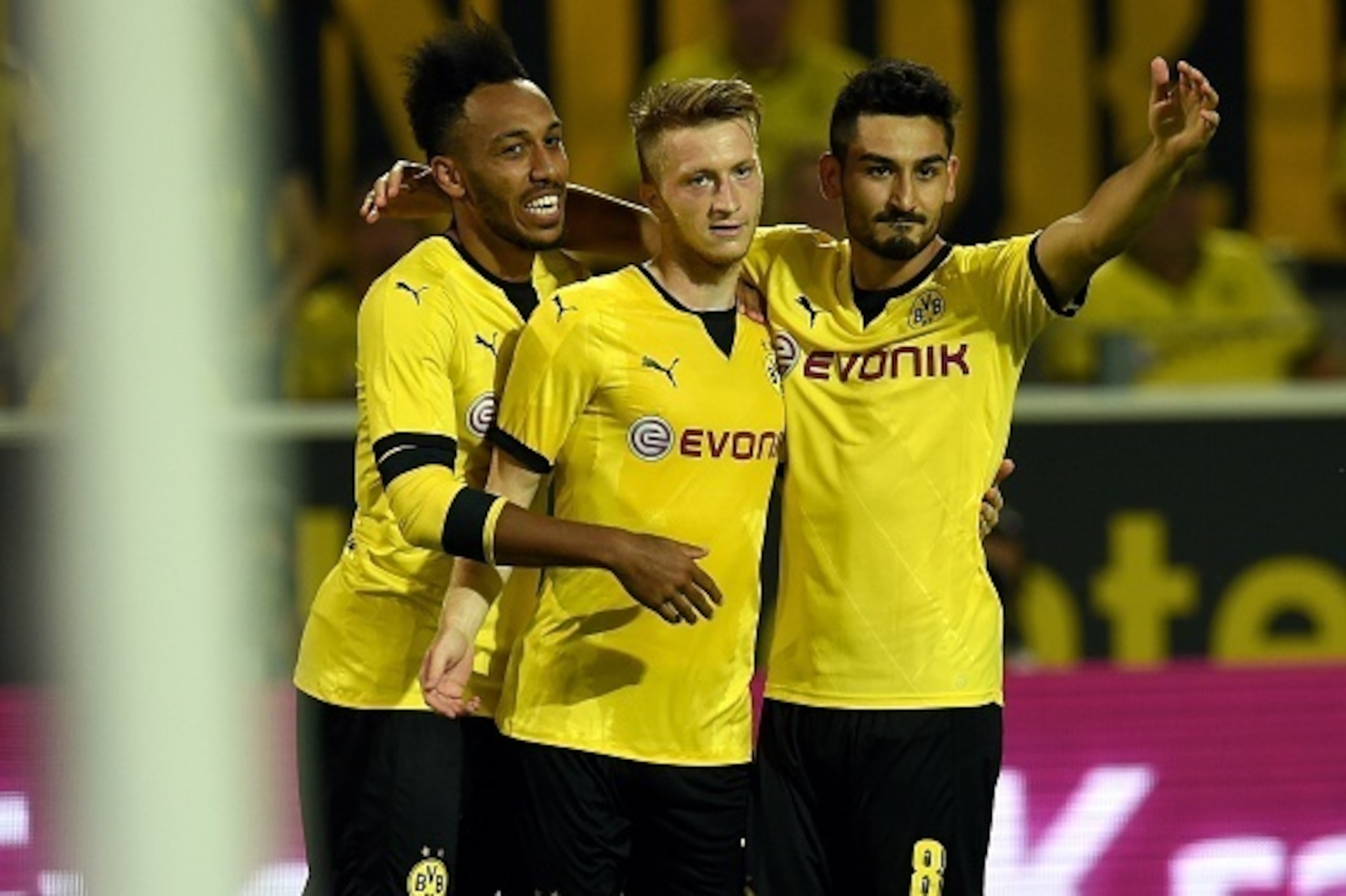 Dortmund's midfielder Ilkay Guendogan (R), Dortmund's striker Marco Reus (C) and Dortmund's Gabonese striker Pierre-Emerick Aubameyang celebrate after Reus scored during the UEFA Europa League third qualifying round second leg football match between  Boru