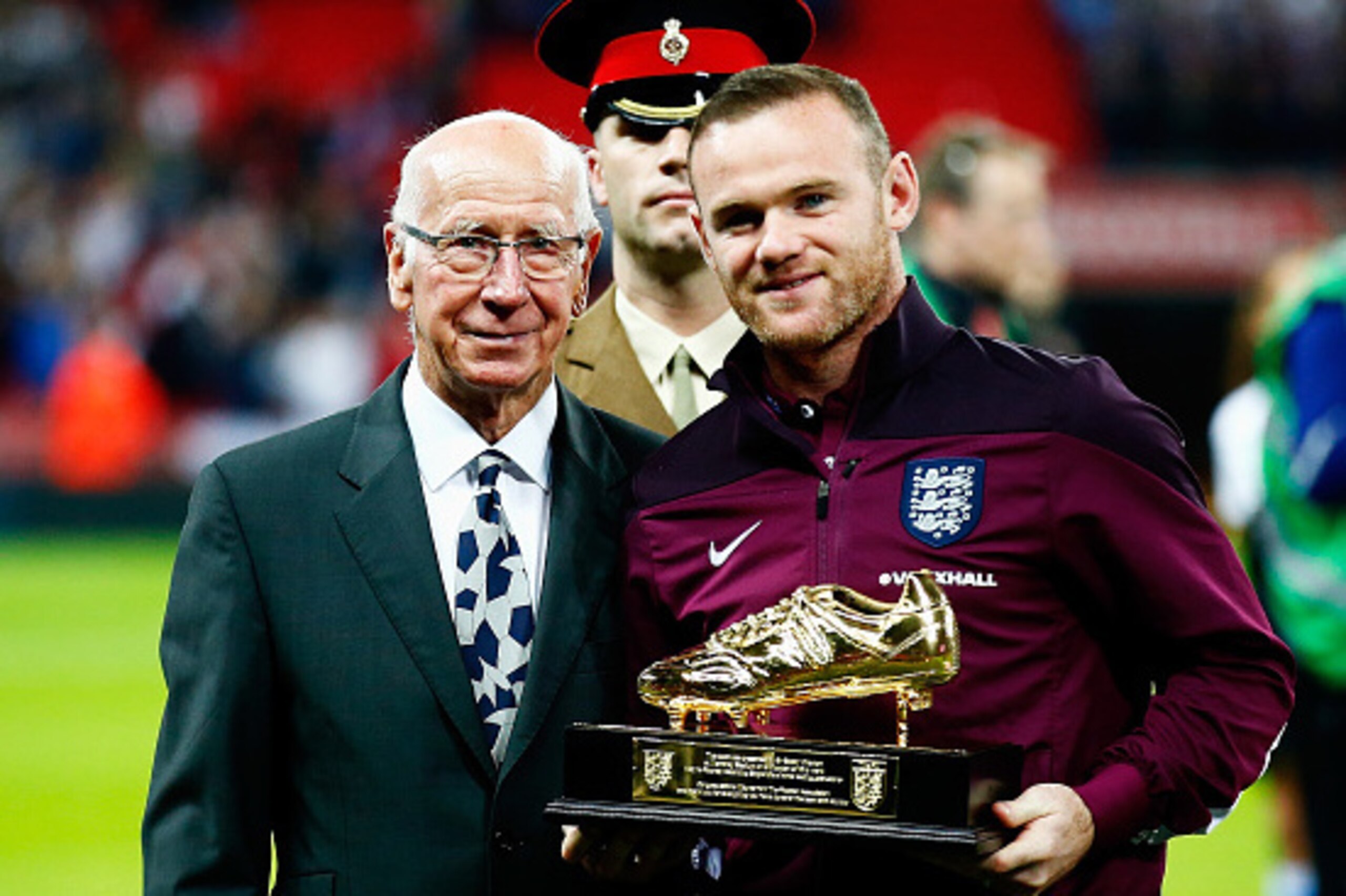 LONDON, ENGLAND - OCTOBER 09:  Wayne Rooney of England is presented with the Golden Boot by Sir Bobby Charlton after breaking his record of 49 goals prior to the UEFA EURO 2016 Group E qualifying match between England and Estonia at Wembley on October 9, 