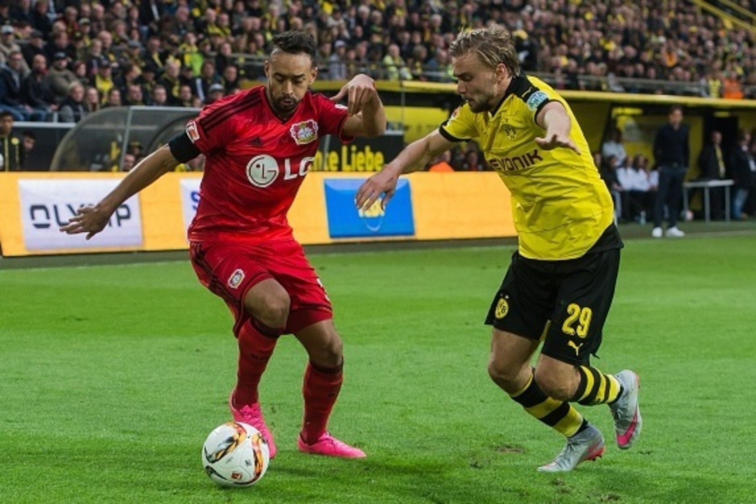 (L-R) Karim Bellarabi of Bayer 04 Leverkusen, Marcel Schmelzer of Borussia Dortmund during the Bundesliga match between Borussia Dortmund and Bayer 04 Leverkusen on September 20, 2015 at the Signal Iduna Park in Dortmund, Germany.(Photo by VI Images via G (L-R) Karim Bellarabi of Bayer 04 Leverkusen, Marcel Schmelzer of Borussia Dortmund during the Bundesliga match between Borussia Dortmund and Bayer 04 Leverkusen on September 20, 2015 at the Signal Iduna Park in Dortmund, Germany.(Photo by VI Images via G
