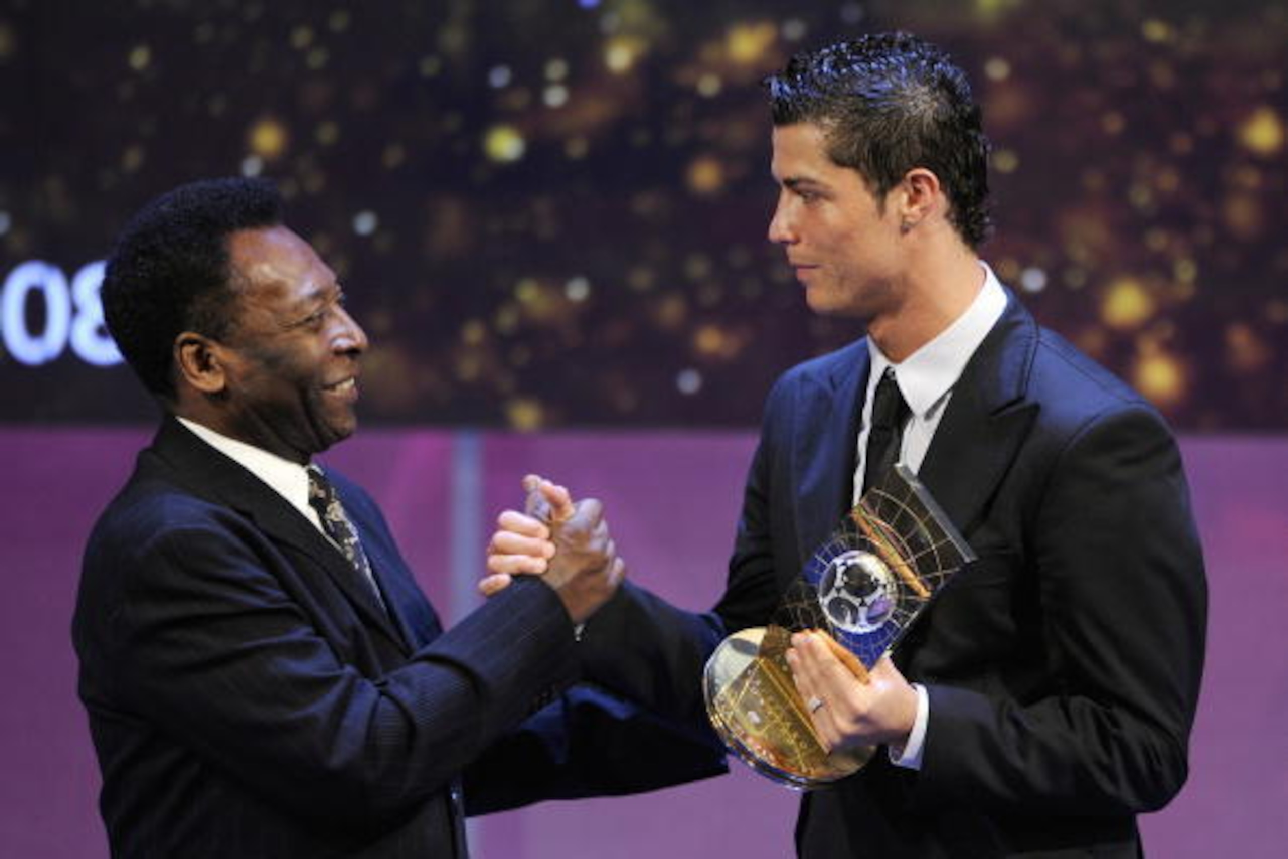 Portuguese football player Cristiano Ronaldo (R) receives congratulations from Brazilian football legend Pele after recieving the FIFA world footballer of the year 2008 award on January 12, 2009 in Zurich. Ronaldo, who is also holder of the prestigious Ba