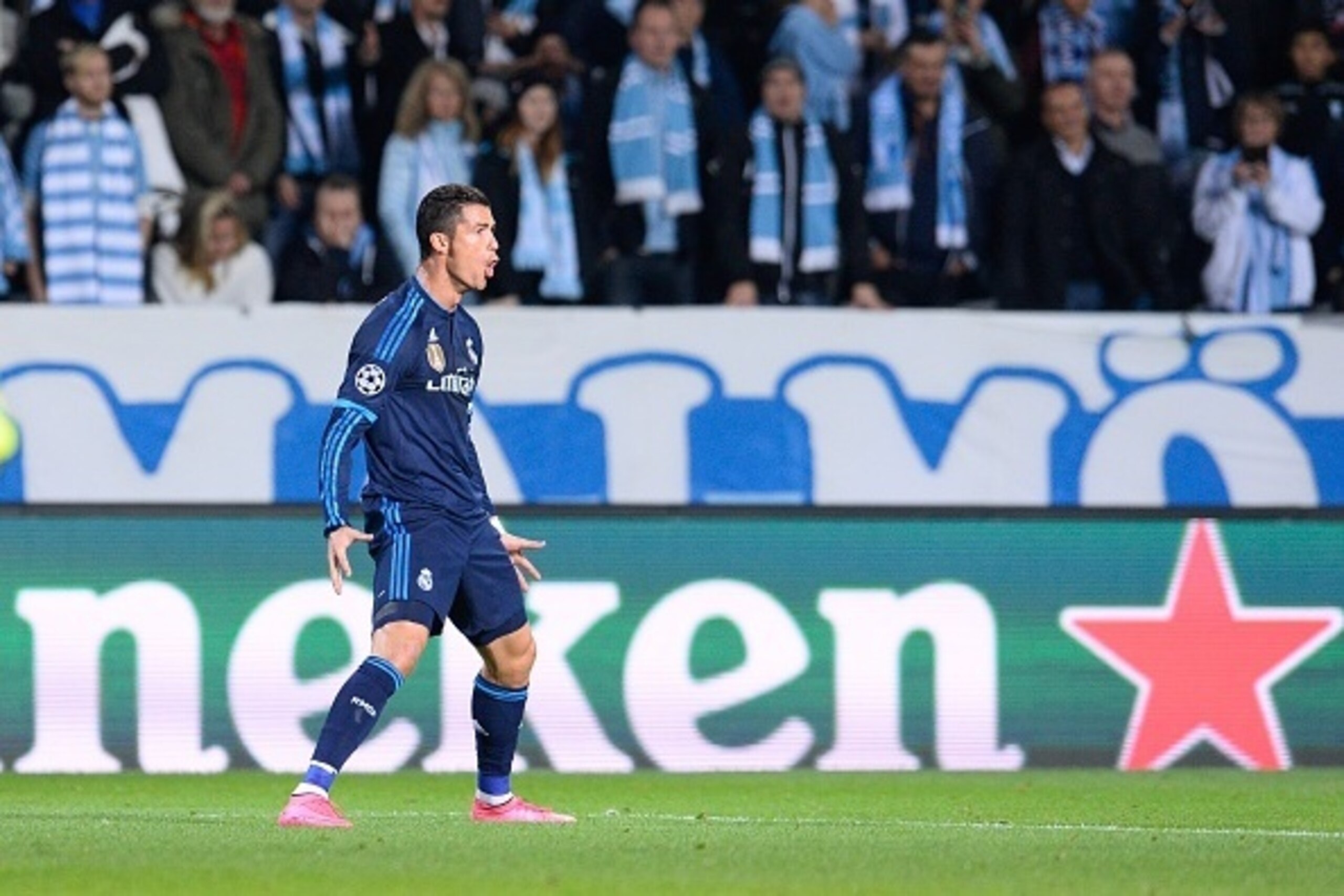 Real Madrid's Portuguese forward Cristiano Ronaldo celebrates after scoring the opening goal during the UEFA Champions League first-leg Group A football match between Malmo FF and Real Madrid CF at the Swedbank Stadion, in Malmo, Sweden on September 30, 2
