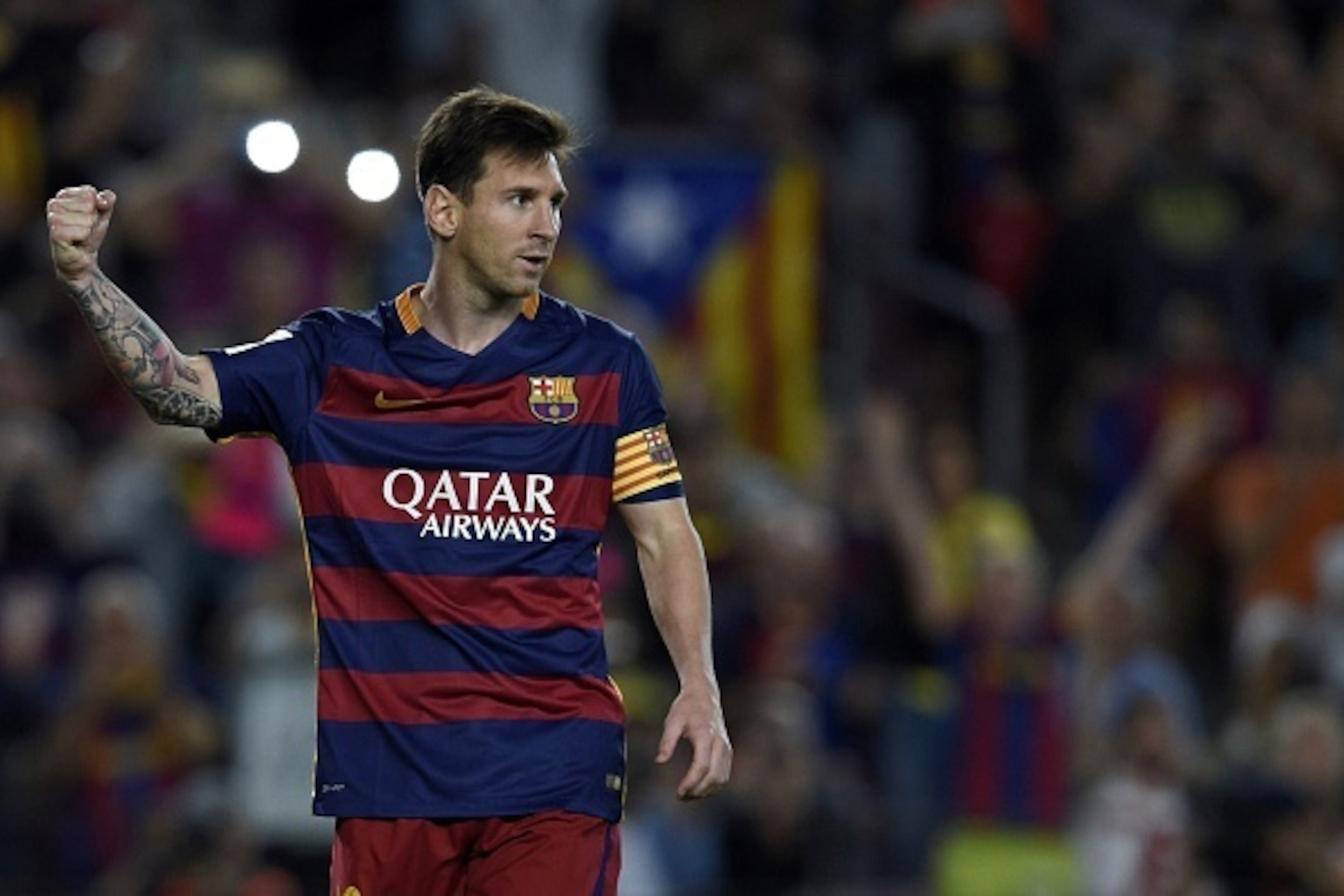 Barcelona's Argentinian forward Lionel Messi celebrates after scoring a goal on a penalty kick during the Spanish league football match FC Barcelona vs Levante UD at the Camp Nou stadium in Barcelona on September 20, 2015.   AFP PHOTO/ LLUIS GENE        (