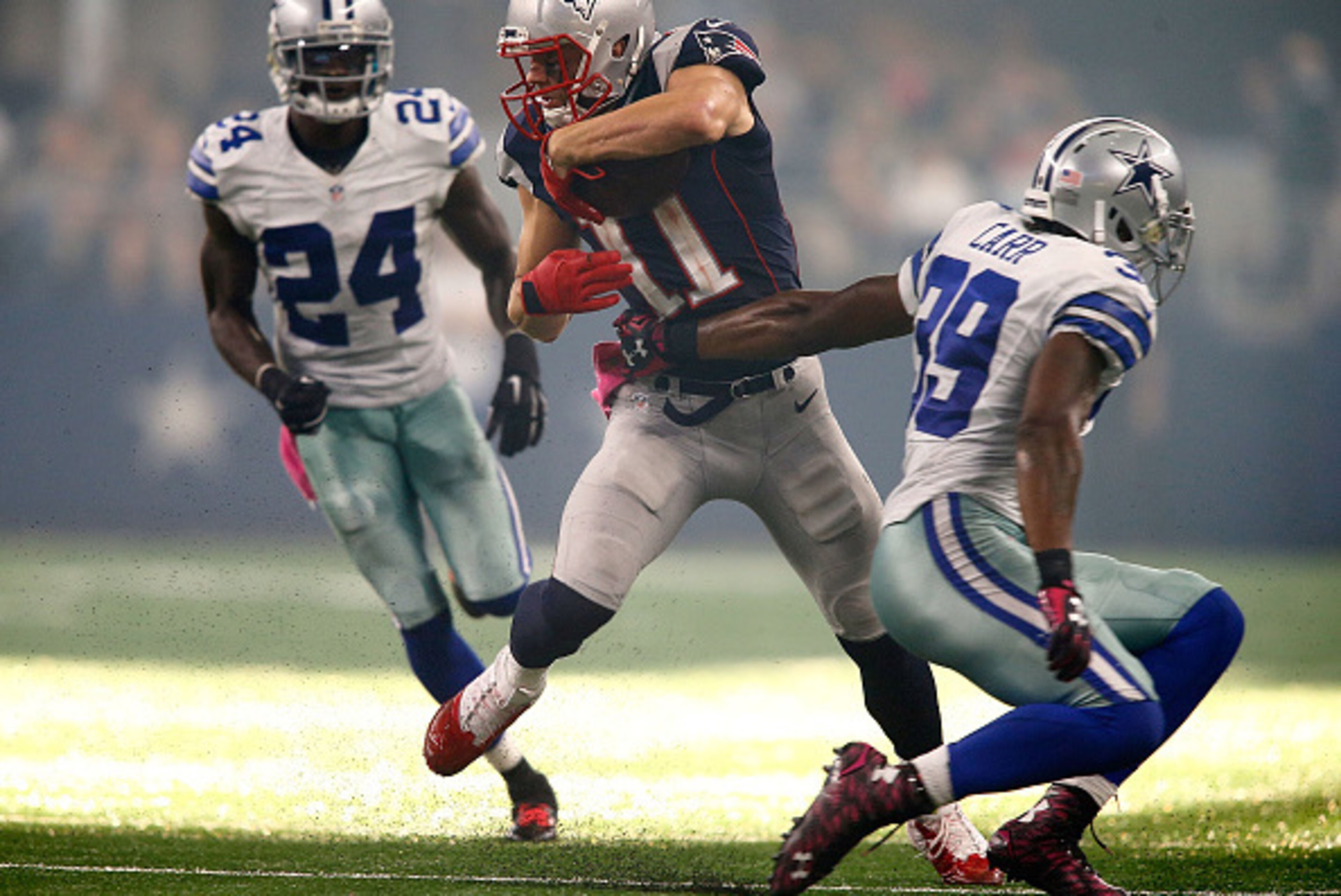 ARLINGTON, TX - OCTOBER 11: Julian Edelman #11 of the New England Patriots cuts between Morris Claiborne #24 of the Dallas Cowboys and Brandon Carr #39 of the Dallas Cowboys on his way to a touchdown during the second half of the NFL game at AT&T Stadium ARLINGTON, TX - OCTOBER 11: Julian Edelman #11 of the New England Patriots cuts between Morris Claiborne #24 of the Dallas Cowboys and Brandon Carr #39 of the Dallas Cowboys on his way to a touchdown during the second half of the NFL game at AT&T Stadium