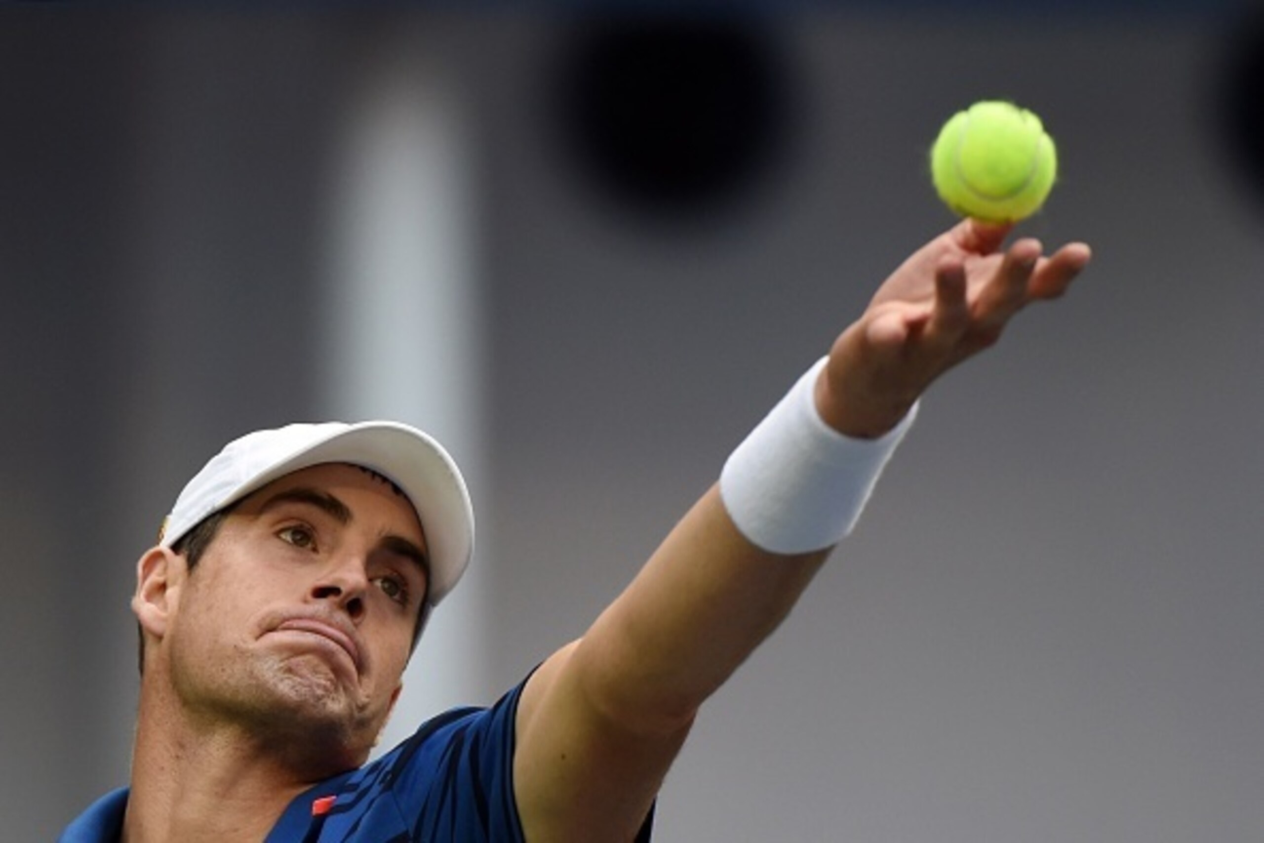 John Isner of the US serves to Adrian Mannarino of France during their men's singles first round match at the Shanghai Masters tennis tournament in Shanghai on October 12, 2015. AFP PHOTO / GREG BAKER        (Photo credit should read GREG BAKER/AFP/Getty 