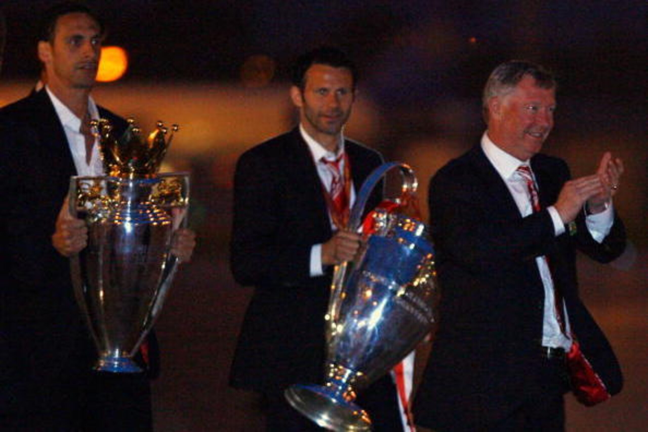 MANCHESTER - MAY 22:  Rio Ferdinand, Ryan Giggs and Alex Ferguson arrive back from Moscow after their win over Chelsea in the Champions League final on May 22, 2008 in Manchester, England.  (Photo by Jeff J Mitchell/Getty Images)