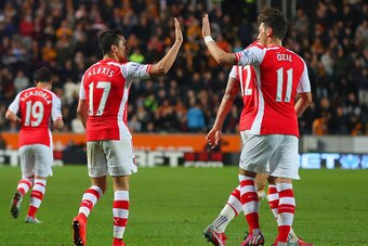 HULL, ENGLAND - MAY 04:  Alexis Sanchez of Arsenal celebrates with Mesut Oezil as he scores their third goal during the Barclays Premier League match between Hull City and Arsenal at KC Stadium on May 4, 2015 in Hull, England.  (Photo by Alex Livesey/Gett