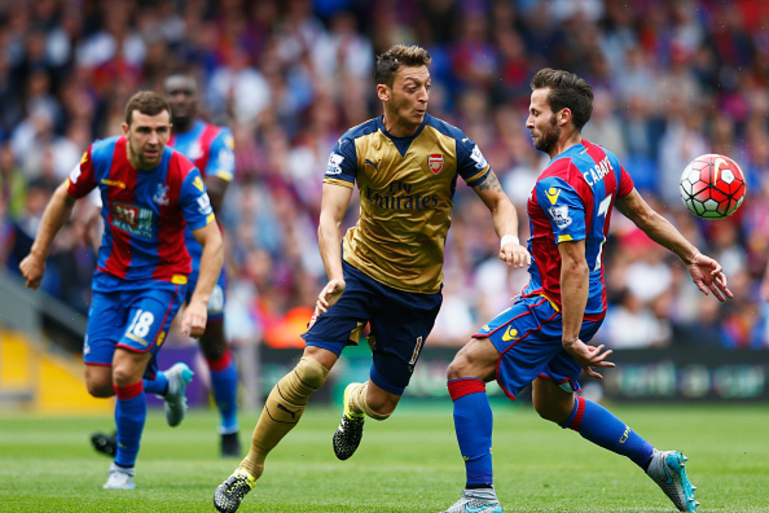 LONDON, ENGLAND - AUGUST 16: Mesut Oezil of Arsenal is challenged by Yohan Cabaye of Crystal Palace during the Barclays Premier League match between Crystal Palace and Arsenal at Selhurst Park on August 16, 2015 in London, England. (Photo by Julian Finne LONDON, ENGLAND - AUGUST 16: Mesut Oezil of Arsenal is challenged by Yohan Cabaye of Crystal Palace during the Barclays Premier League match between Crystal Palace and Arsenal at Selhurst Park on August 16, 2015 in London, England. (Photo by Julian Finne