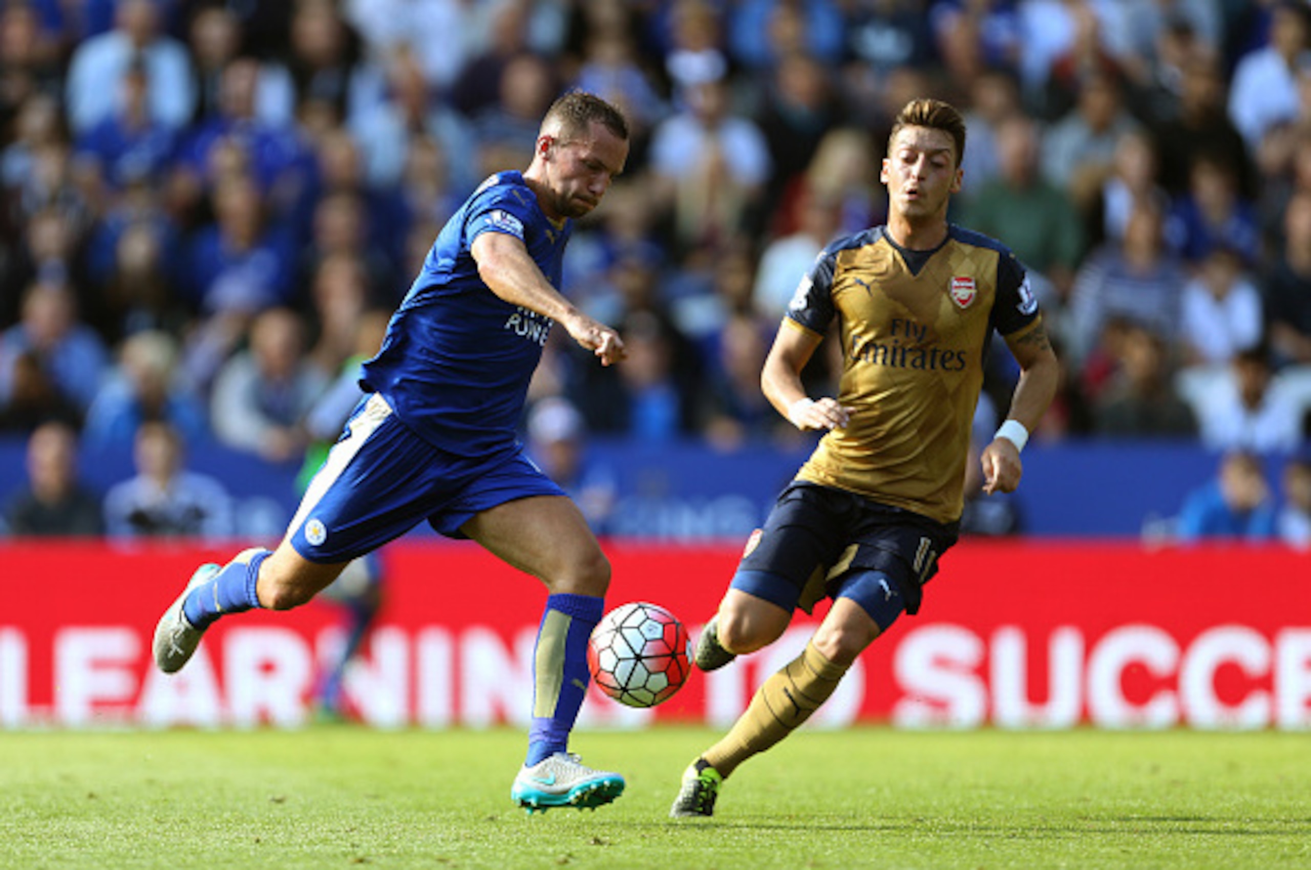 LEICESTER, ENGLAND - SEPTEMBER 26: Daniel Drinkwater of Leicester City and Mesut Ozil of Arsenal during the Barclays Premier League match between Leicester City and Arsenal at The King Power Stadium on September 26, 2015 in Leicester, United Kingdom. (P LEICESTER, ENGLAND - SEPTEMBER 26: Daniel Drinkwater of Leicester City and Mesut Ozil of Arsenal during the Barclays Premier League match between Leicester City and Arsenal at The King Power Stadium on September 26, 2015 in Leicester, United Kingdom. (P