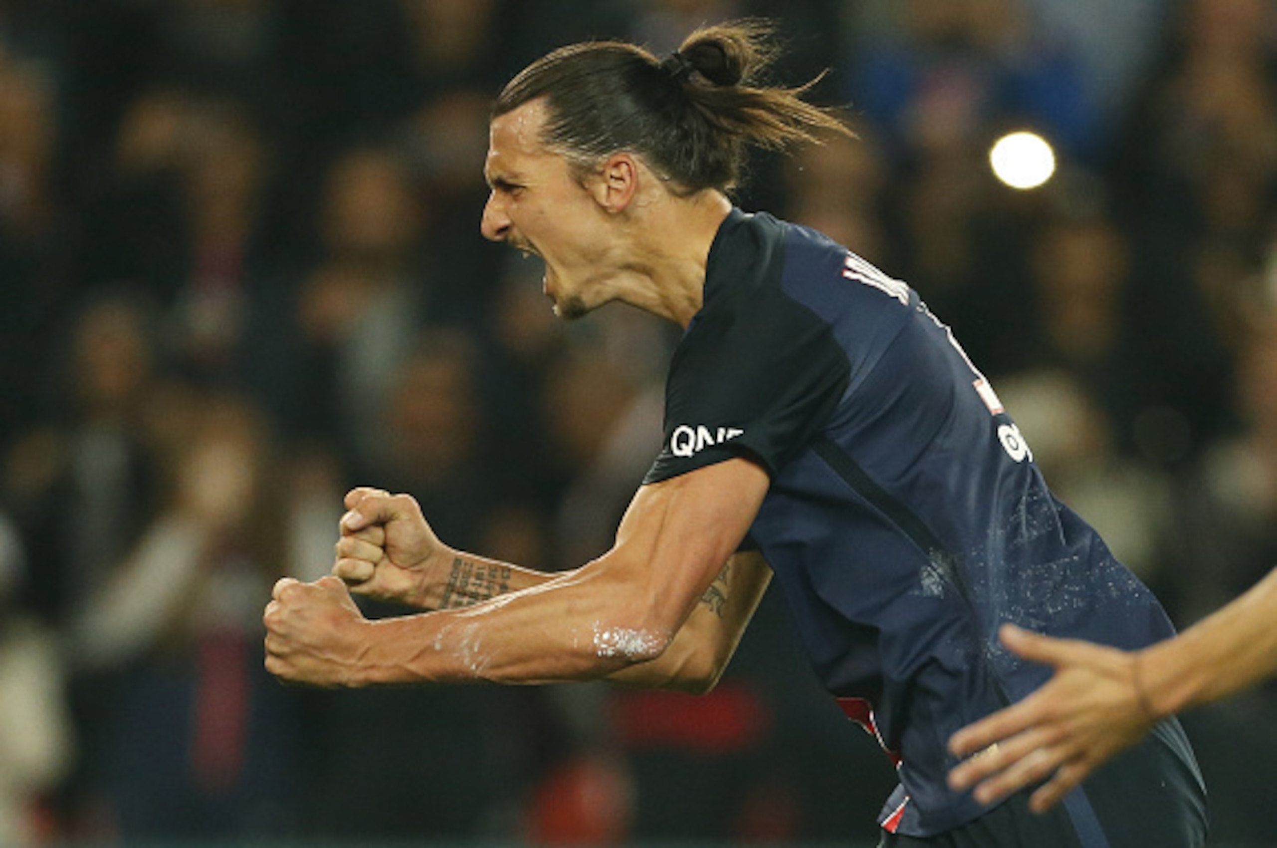 PARIS, FRANCE - OCTOBER 4: Zlatan Ibrahimovic of PSG celebrates scoring a goal during the French Ligue 1 match between Paris Saint-Germain FC (PSG) and Olympique de Marseille at Parc des Princes stadium on October 4, 2015 in Paris, France. (Photo by Jean