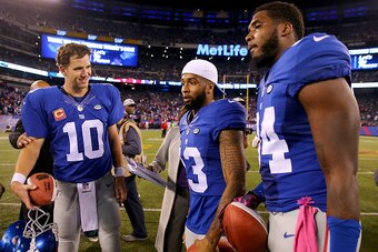 EAST RUTHERFORD, NJ - OCTOBER 11:  Eli Manning #10,Odell Beckham Jr. #13 and Larry Donnell #84 of the New York Giants received Sunday Night Football Player of the Game balls after the win over the San Francisco 49ers at MetLife Stadium on October 11, 2015