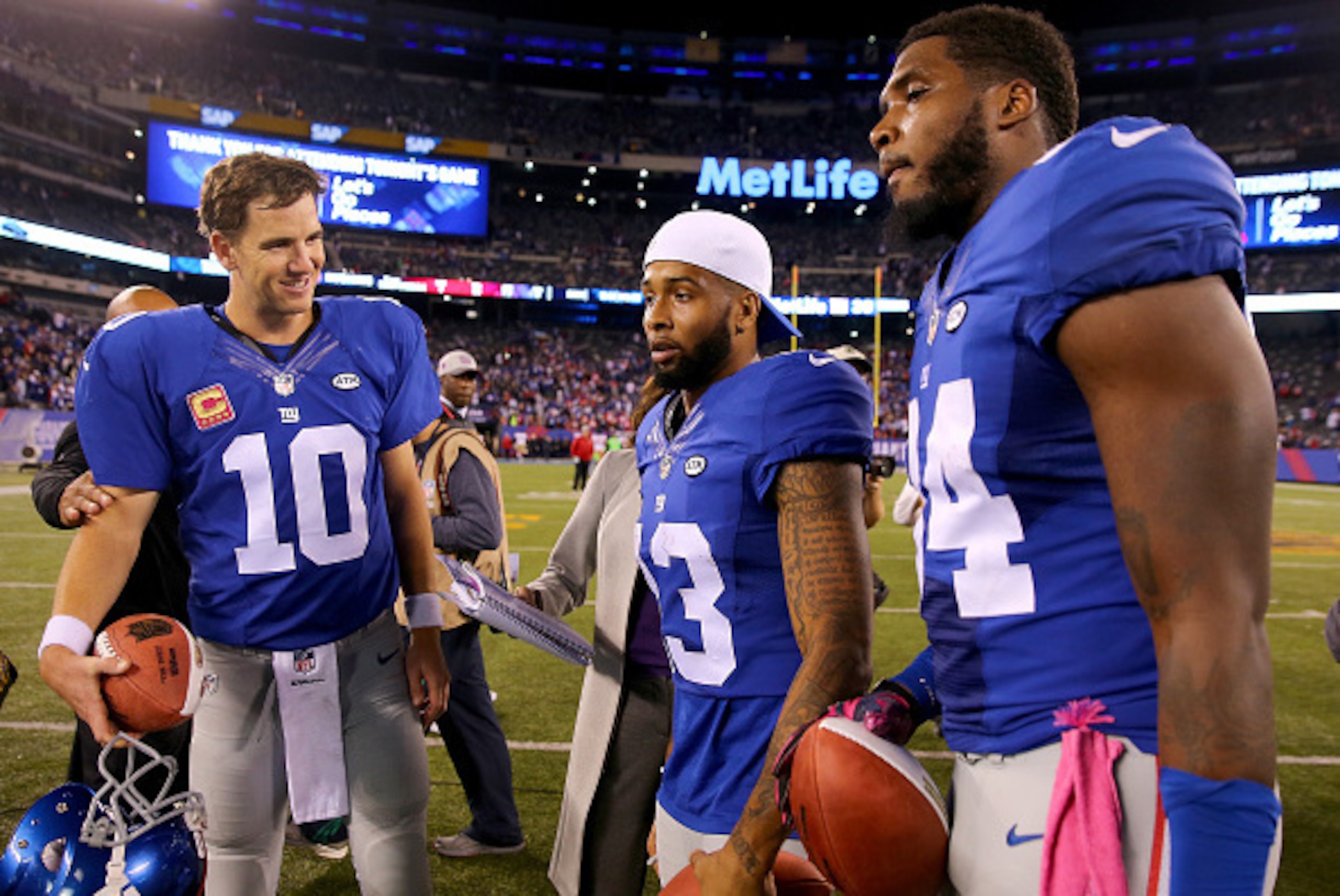 EAST RUTHERFORD, NJ - OCTOBER 11: Eli Manning #10,Odell Beckham Jr. #13 and Larry Donnell #84 of the New York Giants received Sunday Night Football Player of the Game balls after the win over the San Francisco 49ers at MetLife Stadium on October 11, 2015 EAST RUTHERFORD, NJ - OCTOBER 11: Eli Manning #10,Odell Beckham Jr. #13 and Larry Donnell #84 of the New York Giants received Sunday Night Football Player of the Game balls after the win over the San Francisco 49ers at MetLife Stadium on October 11, 2015