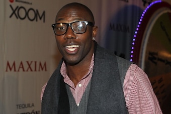 DALLAS, TX - FEBRUARY 05:  NFL player Terrell Owens poses with Motorola Xoom at the Maxim Party Powered by Motorola Xoom at Centennial Hall at Fair Park on February 5, 2011 in Dallas, Texas.  (Photo by Gary Miller/Getty Images for Motorola Xoom)
