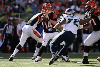 CINCINNATI, OH - OCTOBER 11: Andy Dalton #14 of the Cincinnati Bengals drops back to throw a pass during the fourth quarter of the game against the Seattle Seahawks at Paul Brown Stadium on October 11, 2015 in Cincinnati, Ohio. Cincinnati defeated Seattle