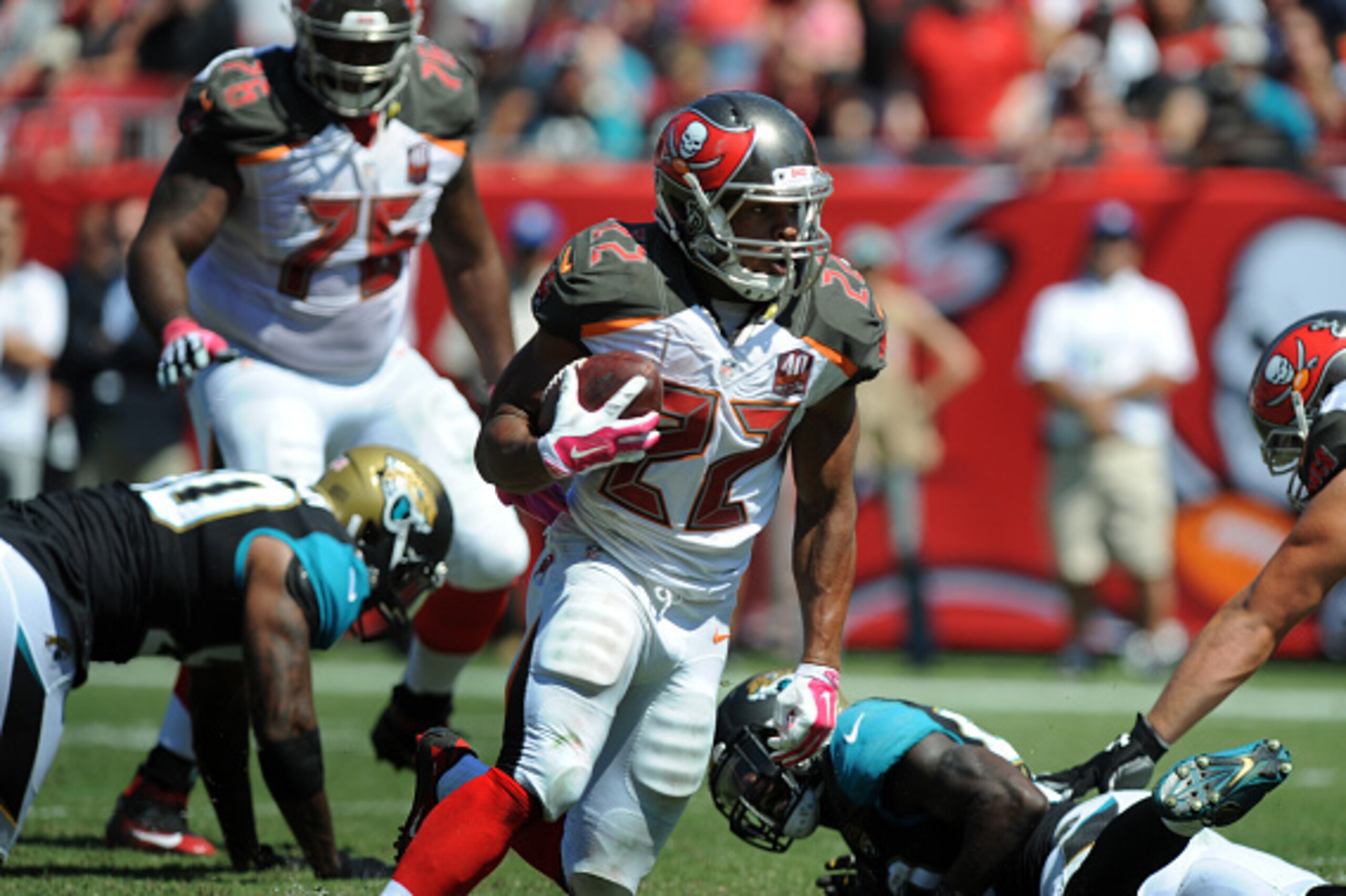 TAMPA, FL - OCTOBER 11: Running back Doug Martin #22 of the Tampa Bay Buccaneers runs with the ball in the second quarter against the Jacksonville Jaguars at Raymond James Stadium on October 11, 2015 in Tampa, Florida. (Photo by Cliff McBride/Getty Images TAMPA, FL - OCTOBER 11: Running back Doug Martin #22 of the Tampa Bay Buccaneers runs with the ball in the second quarter against the Jacksonville Jaguars at Raymond James Stadium on October 11, 2015 in Tampa, Florida. (Photo by Cliff McBride/Getty Images