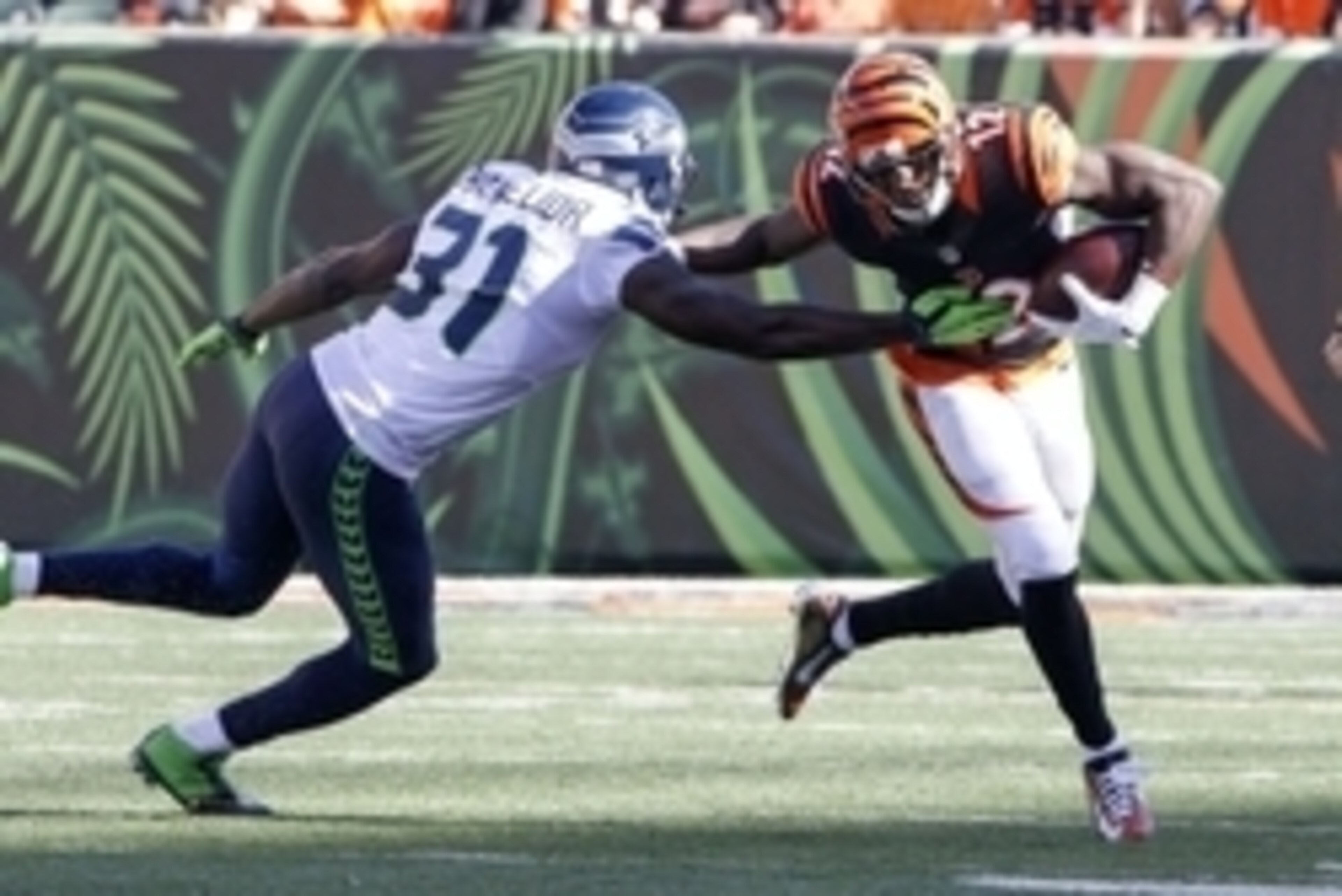 Oct 11, 2015; Cincinnati, OH, USA; Seattle Seahawks safety Kam Chancellor (31) tackles Cincinnati Bengals wide receiver Mohamed Sanu (12) during the game at Paul Brown Stadium. Cincinnati defeated Seattle 27-24. Mandatory Credit: Mark Zerof-USA TODAY Spor Oct 11, 2015; Cincinnati, OH, USA; Seattle Seahawks safety Kam Chancellor (31) tackles Cincinnati Bengals wide receiver Mohamed Sanu (12) during the game at Paul Brown Stadium. Cincinnati defeated Seattle 27-24. Mandatory Credit: Mark Zerof-USA TODAY Spor