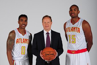 ATLANTA, GA - SEPTEMBER 28: Jeff Teague #0, Head Coach Mike Budenholzer, and Al Horford #15 of the Atlanta Hawks pose during NBA Photo Day on September 28, 2015 at Philips Arena in Atlanta, Georgia.  NOTE TO USER: User expressly acknowledges and agrees th