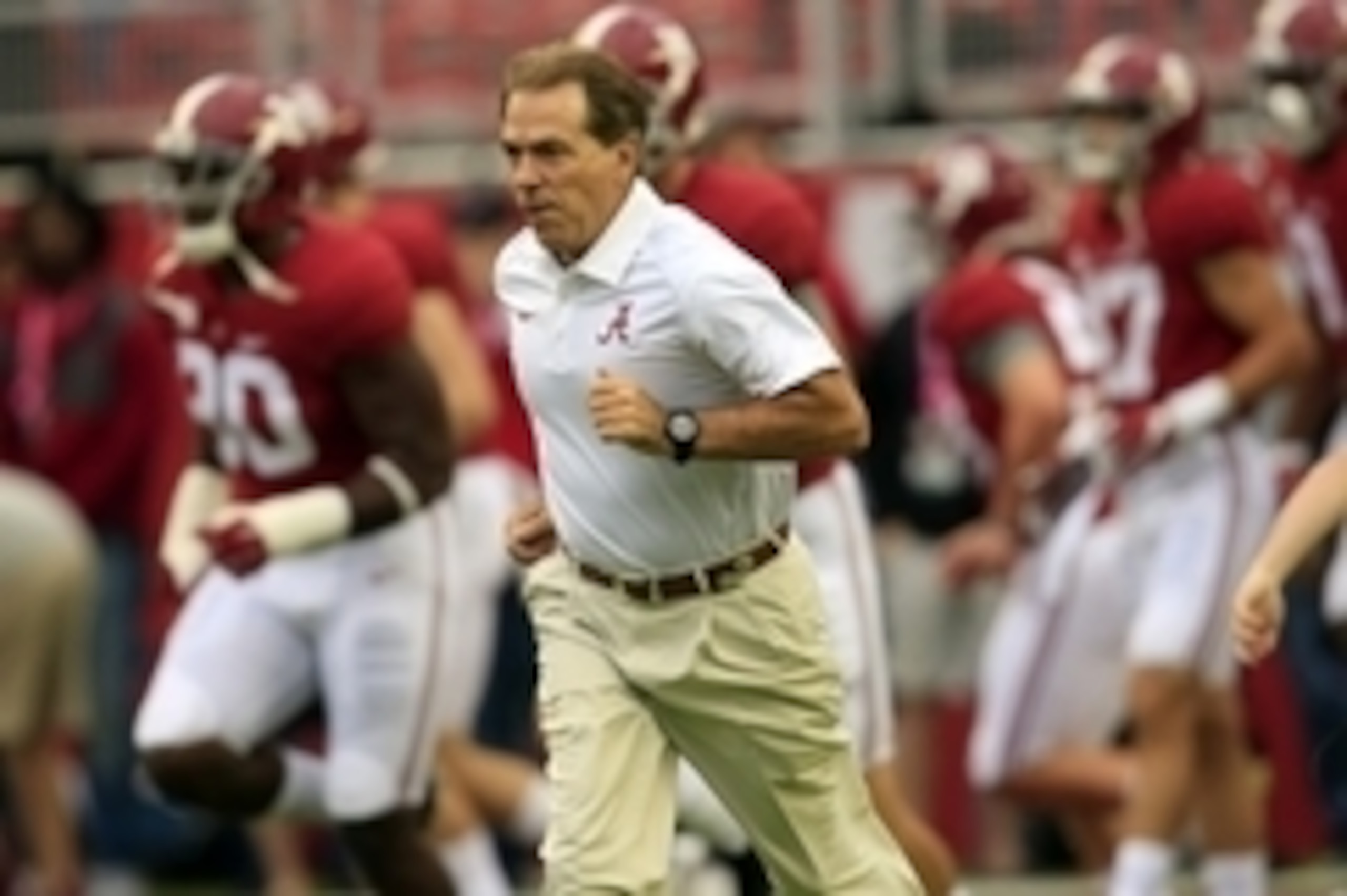 Oct 10, 2015; Tuscaloosa, AL, USA; Alabama Crimson Tide head coach Nick Saban walk onto the field with his players for pre game warm ups against the Arkansas Razorbacks at Bryant-Denny Stadium. Mandatory Credit: Marvin Gentry-USA TODAY Sports