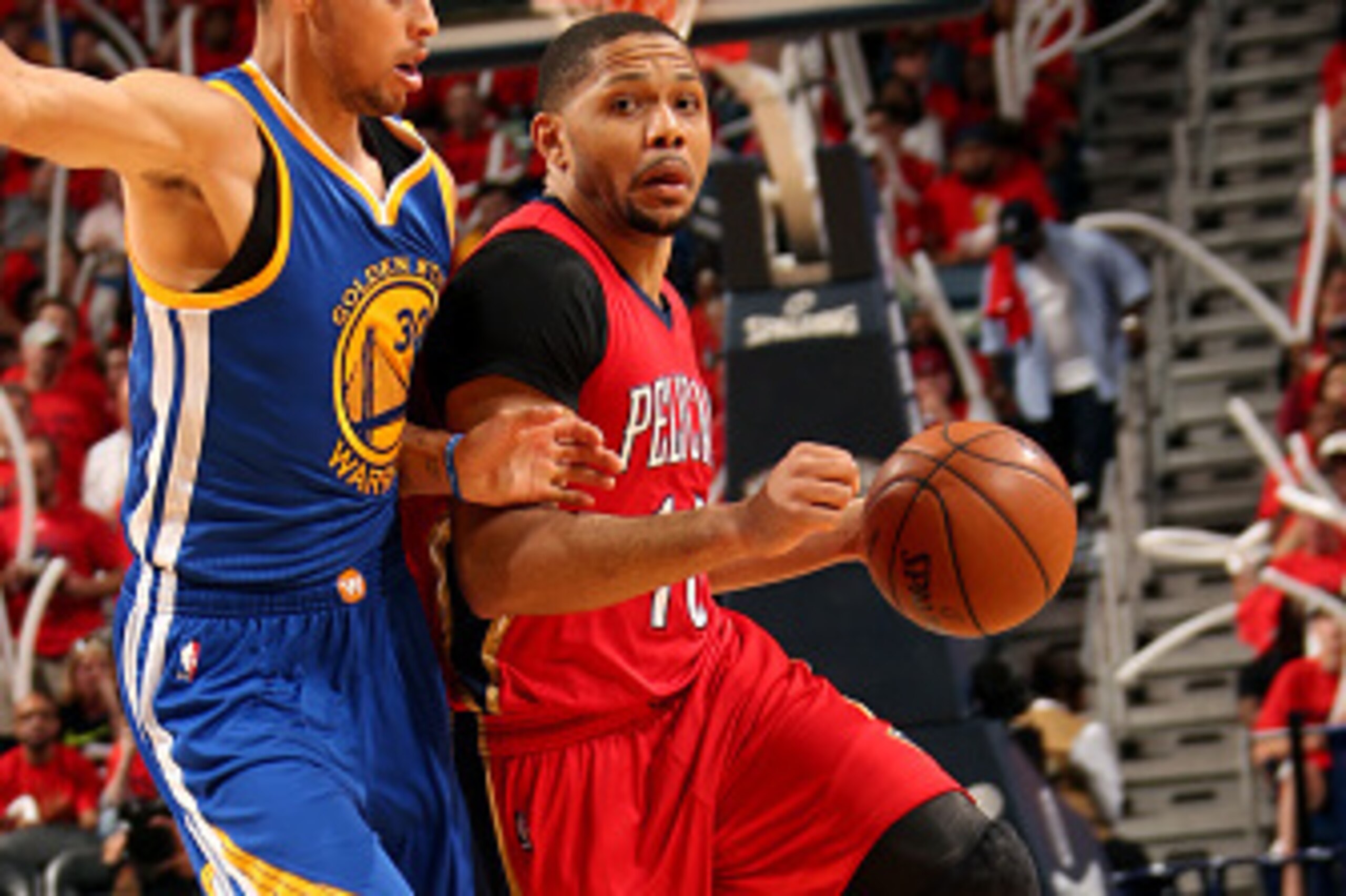 NEW ORLEANS, LA - APRIL 23: Eric Gordon #10 of the New Orleans Pelicans drives against the Golden State Warriors in Game Three of the Western Conference Quarterfinals during the NBA Playoffs on April 23, 2015 at Smoothie King Center in New Orleans, Louisi