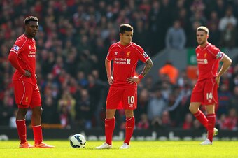 LIVERPOOL, ENGLAND - MARCH 22: Daniel Sturridge (L), Philippe Coutinho and Jordan Henderson of Liverpool look dejected after the opening goal by Juan Mata of Manchester United during the Barclays Premier League match between Liverpool and Manchester Unite