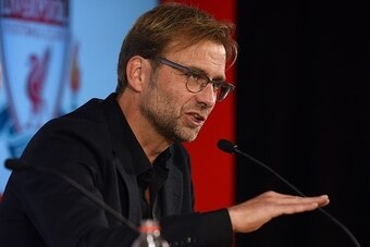Liverpool's new German manager Jurgen Klopp (R) talks during a press conference with Liverpool's managing director Ian Ayre (L) to announce his new appointment at Anfield in Liverpool, northwest England, on October 9, 2015. Klopp described his job as 'the
