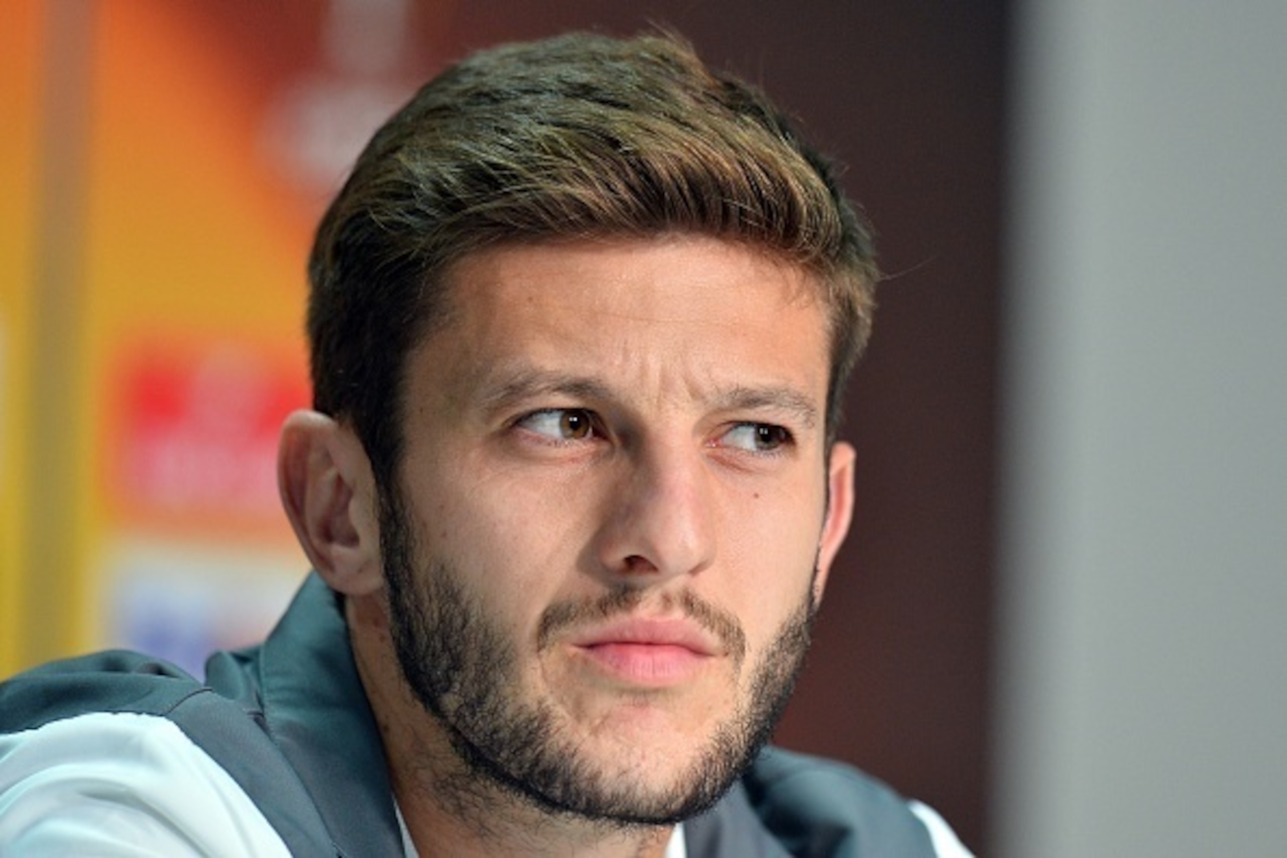 Liverpool's English midfielder Adam Lallana attends a press conference on September 16, 2015 at the Matmut Atlantique stadium in Bordeaux on the eve of the UEFA Europa League Group B Bordeaux vs Liverpool football match. AFP PHOTO / NICOLAS TUCAT        (