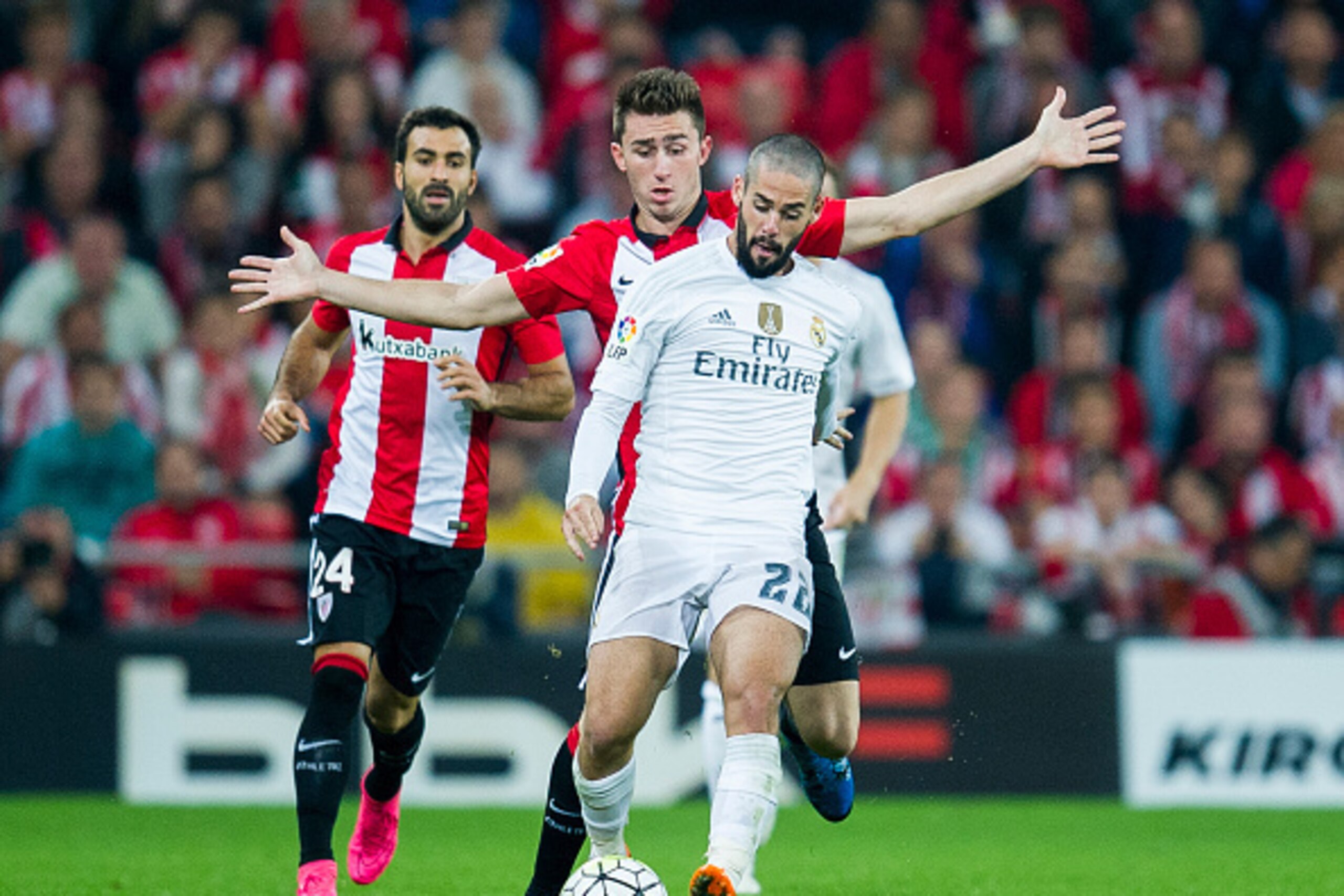 BILBAO, SPAIN - SEPTEMBER 23:  Isco of Real Madrid CF duels for the ball with Aimeric Laporte of Athletic Club Bilbao during the La Liga match between Athletic Club Bilbao and Real Madrid CF at San Mames Stadium on September 23, 2015 in Bilbao, Spain.  (P