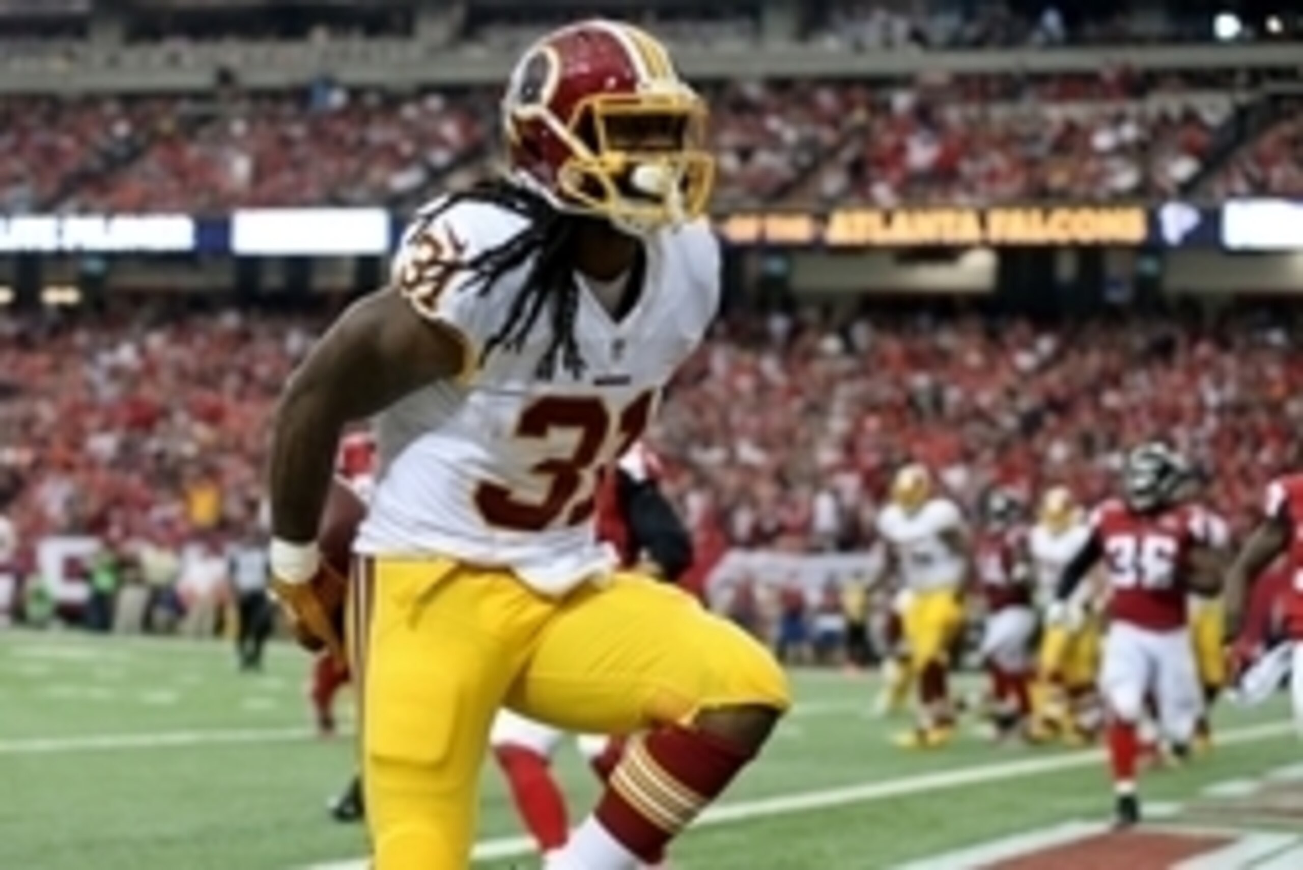 Oct 11, 2015; Atlanta, GA, USA; Washington Redskins running back Matt Jones (31) celebrates as he scores a rushing touchdown in the fourth quarter of their game against the Atlanta Falcons at the Georgia Dome. The Falcons won 25-19 in overtime. Mandatory 