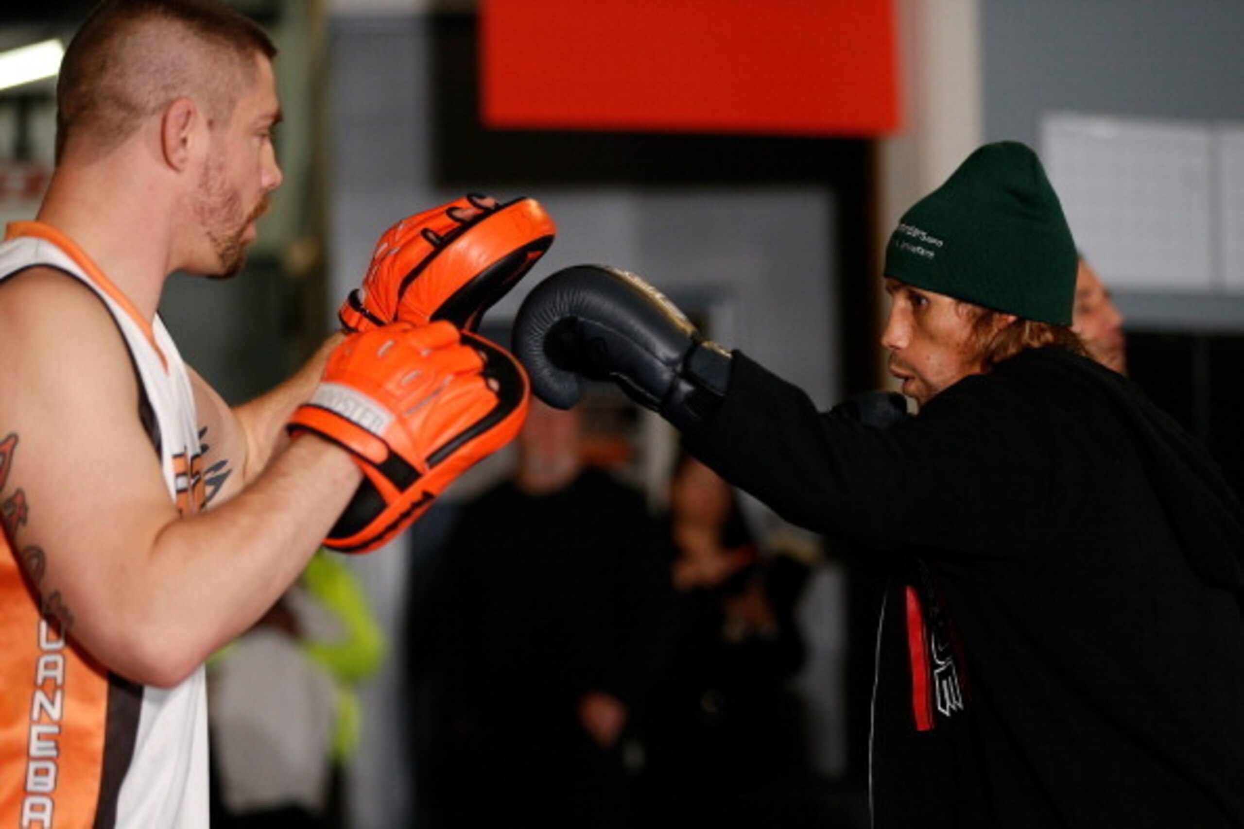 SACRAMENTO, CA - DECEMBER 11:  (R-L) Urijah Faber works out with head coach Duane Ludwig during an open training session for media at Ultimate Fitness on December 11, 2013 in Sacramento, California. (Photo by Josh Hedges/Zuffa LLC/Zuffa LLC via Getty Imag
