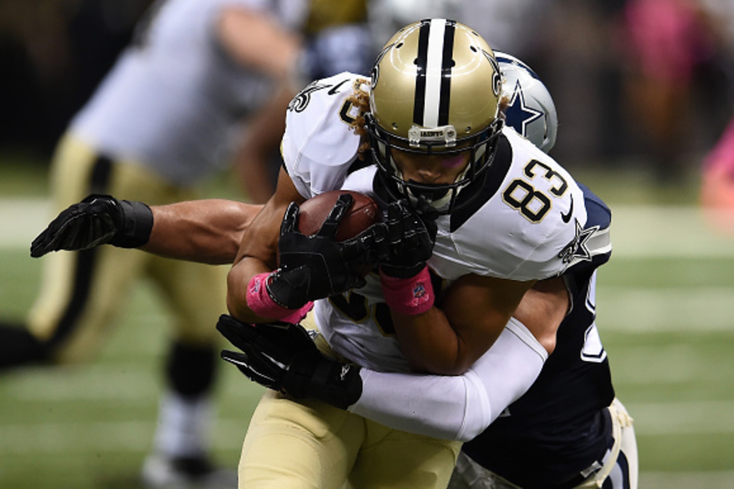 NEW ORLEANS, LA - OCTOBER 04:  Willie Snead #83 of the New Orleans Saints is tackled by  Andrew Gachkar #52 of the Dallas Cowboys during the third quarter against the New Orleans Saints at Mercedes-Benz Superdome on October 4, 2015 in New Orleans, Louisia