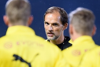 New head coach of Germany's football club Borussia Dortmund Thomas Tuchel (2nd-L) speaks to team members during a training session after their arrival in Japan in Kawasaki, suburb of Tokyo on July 6, 2015.  Borussia Dortmund will play a friendly match wit
