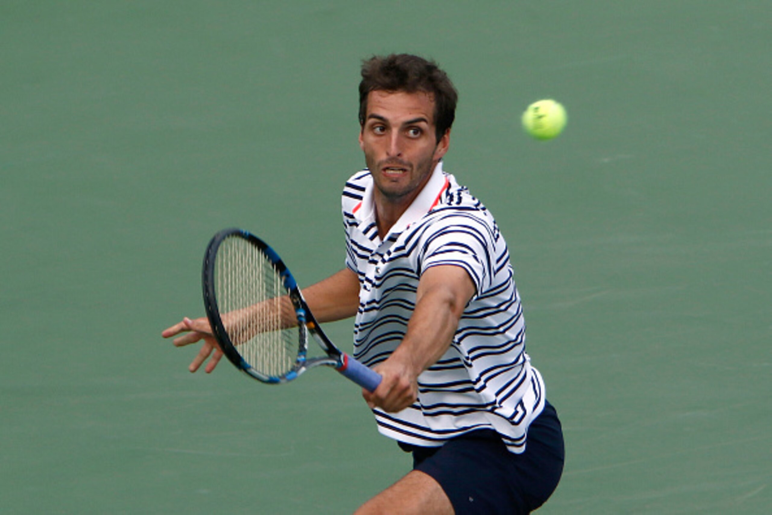 SHANGHAI, CHINA - OCTOBER 10:  Albert Ramos-Vinolas of Spain returns a shot to Zhizhen Zhang of China on the preview of Shanghai Rolex Mastes 2015 at Qi Zhong Tennis Centre on October 10, 2015 in Shanghai, China.  (Photo by Kevin Lee/Getty Images)
