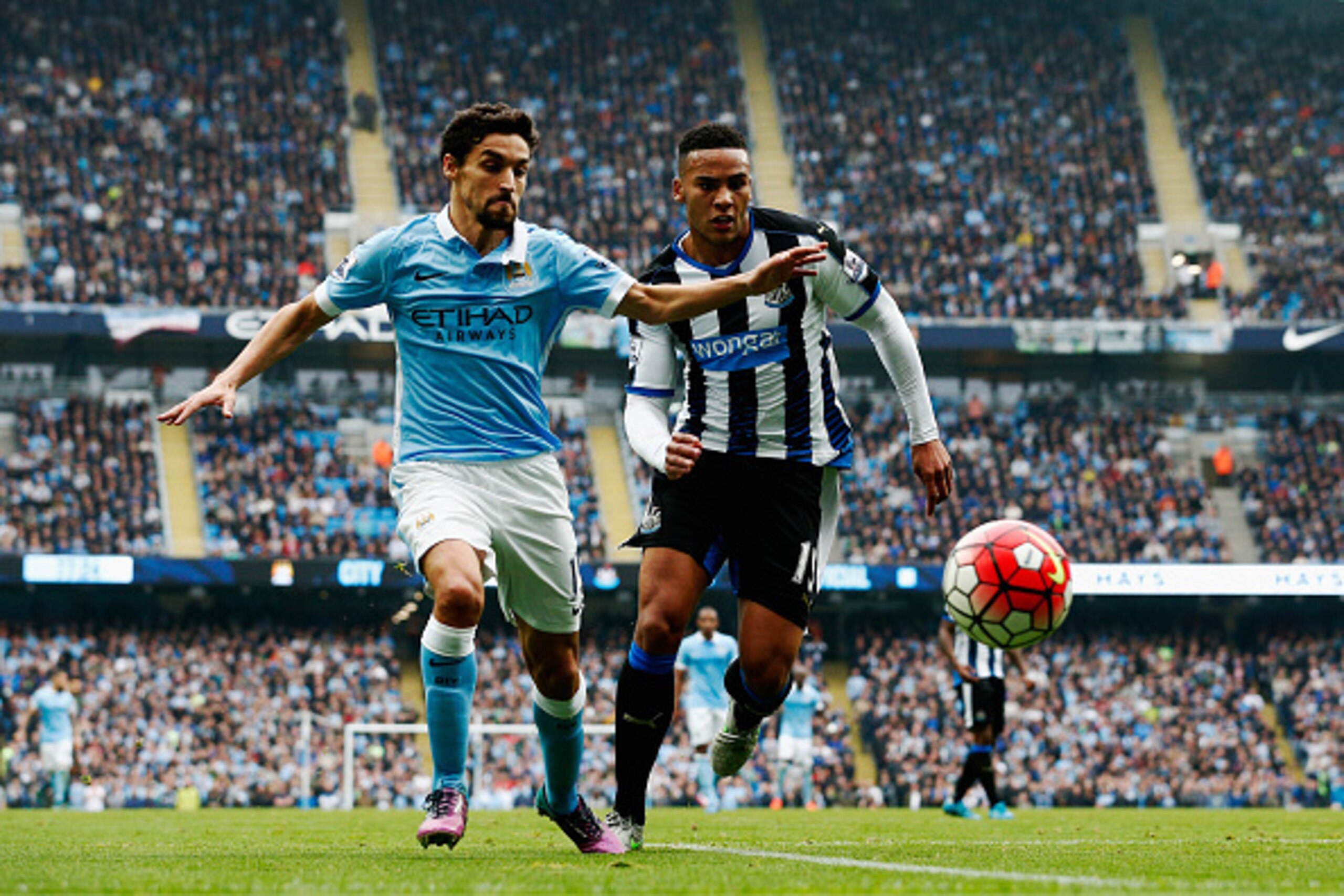 MANCHESTER, ENGLAND - OCTOBER 03: Jesus Navas of Manchester City and Jamaal Lascelles of Newcastle United compete for the ball during the Barclays Premier League match between Manchester City and Newcastle United at Etihad Stadium on October 3, 2015 in M MANCHESTER, ENGLAND - OCTOBER 03: Jesus Navas of Manchester City and Jamaal Lascelles of Newcastle United compete for the ball during the Barclays Premier League match between Manchester City and Newcastle United at Etihad Stadium on October 3, 2015 in M