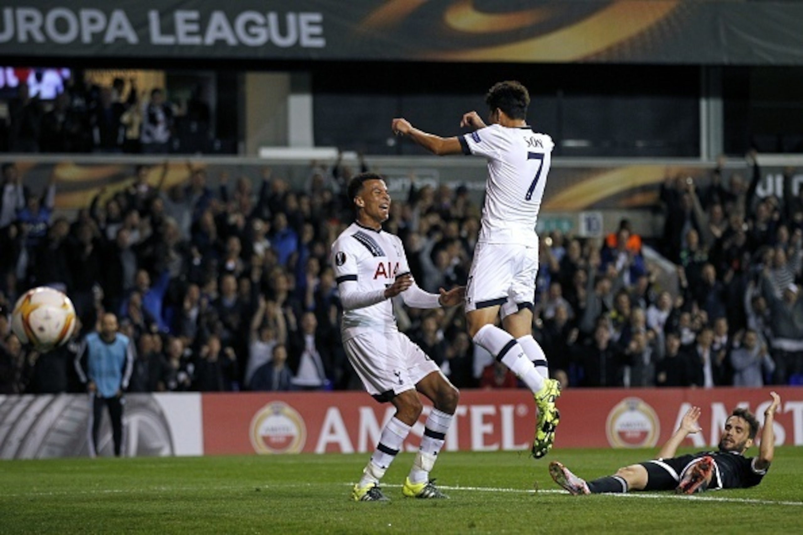 Tottenham Hotspur's South Korean striker Son Heung-Min (2nd R) celebrates scoring his second goal with Tottenham Hotspur's English midfielder Dele Alli (L)  during the UEFA Europa League Group J football match between Tottenham Hotspur FC and Qarabag FK o