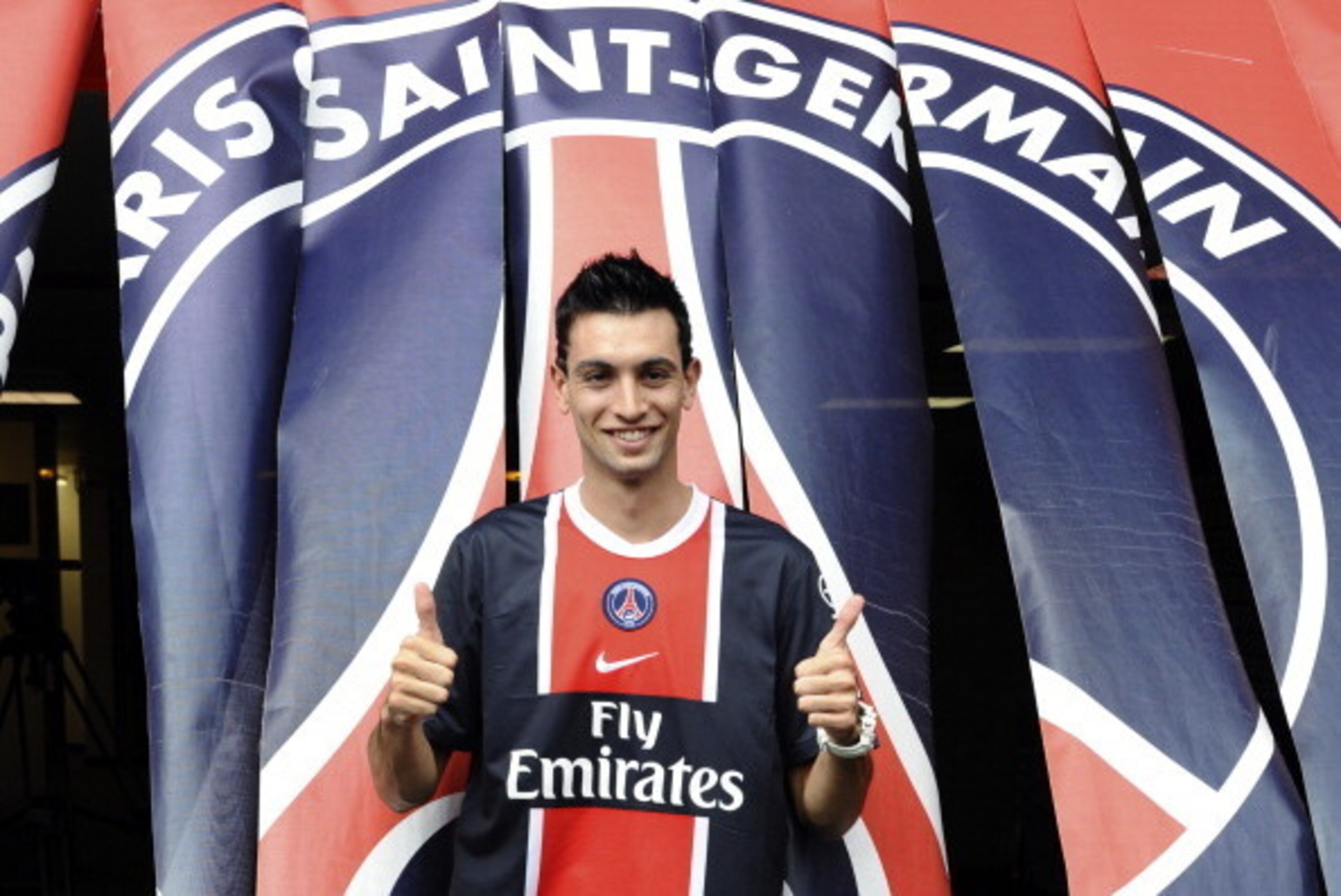 Paris Saint-Germain's newly recruited Argentinian midfielder Javier Matias Pastore gives thumbs up after a press conference on August 8, 2011 at the Parc des Princes in Paris. Pastore is one of the most coveted players in world football and his transfer t
