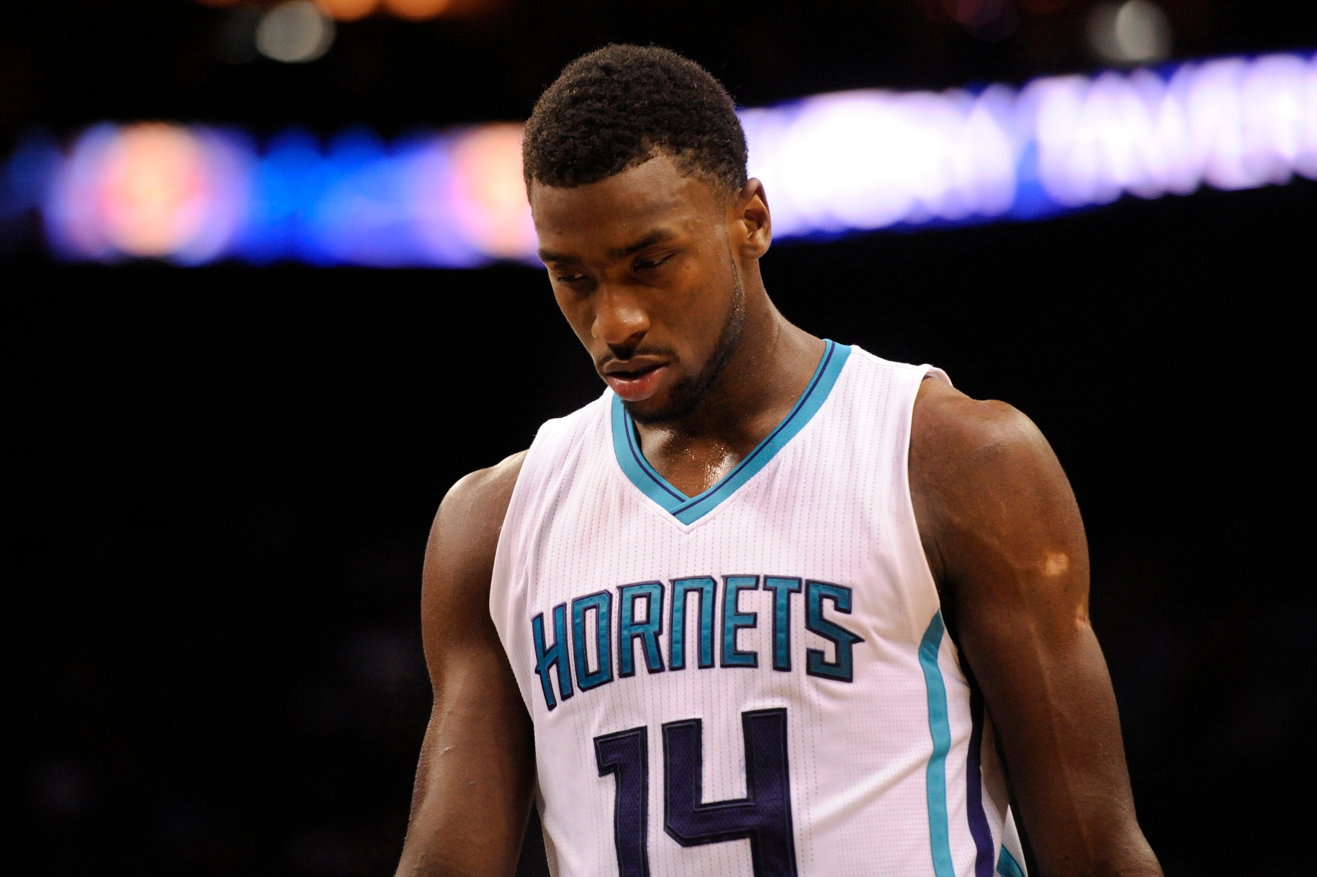 Mar 25, 2015; Charlotte, NC, USA; Charlotte Hornets forward Michael Kidd-Gilchrist (14) in a time out during the second half of the game against the Brooklyn Nets at Time Warner Cable Arena. Nets win 91-88. Mandatory Credit: Sam Sharpe-USA TODAY Sports