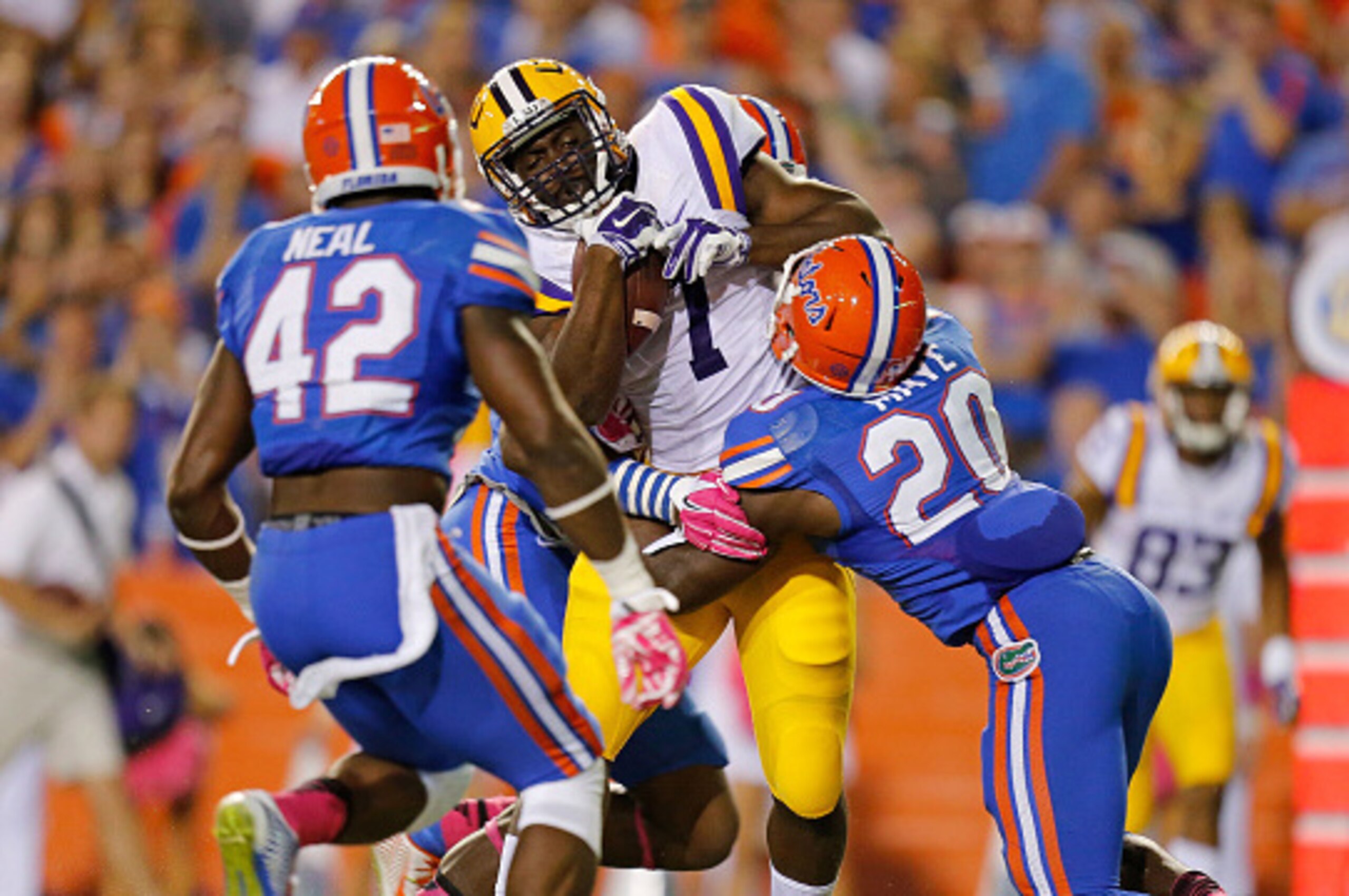 GAINESVILLE, FL - OCTOBER 11: Leonard Fournette #7 of the LSU Tigers scores a touchdown as Marcus Maye #20 of the Florida Gators defends during the first quarter of the game at Ben Hill Griffin Stadium on October 11, 2014 in Gainesville, Florida. (Photo GAINESVILLE, FL - OCTOBER 11: Leonard Fournette #7 of the LSU Tigers scores a touchdown as Marcus Maye #20 of the Florida Gators defends during the first quarter of the game at Ben Hill Griffin Stadium on October 11, 2014 in Gainesville, Florida. (Photo