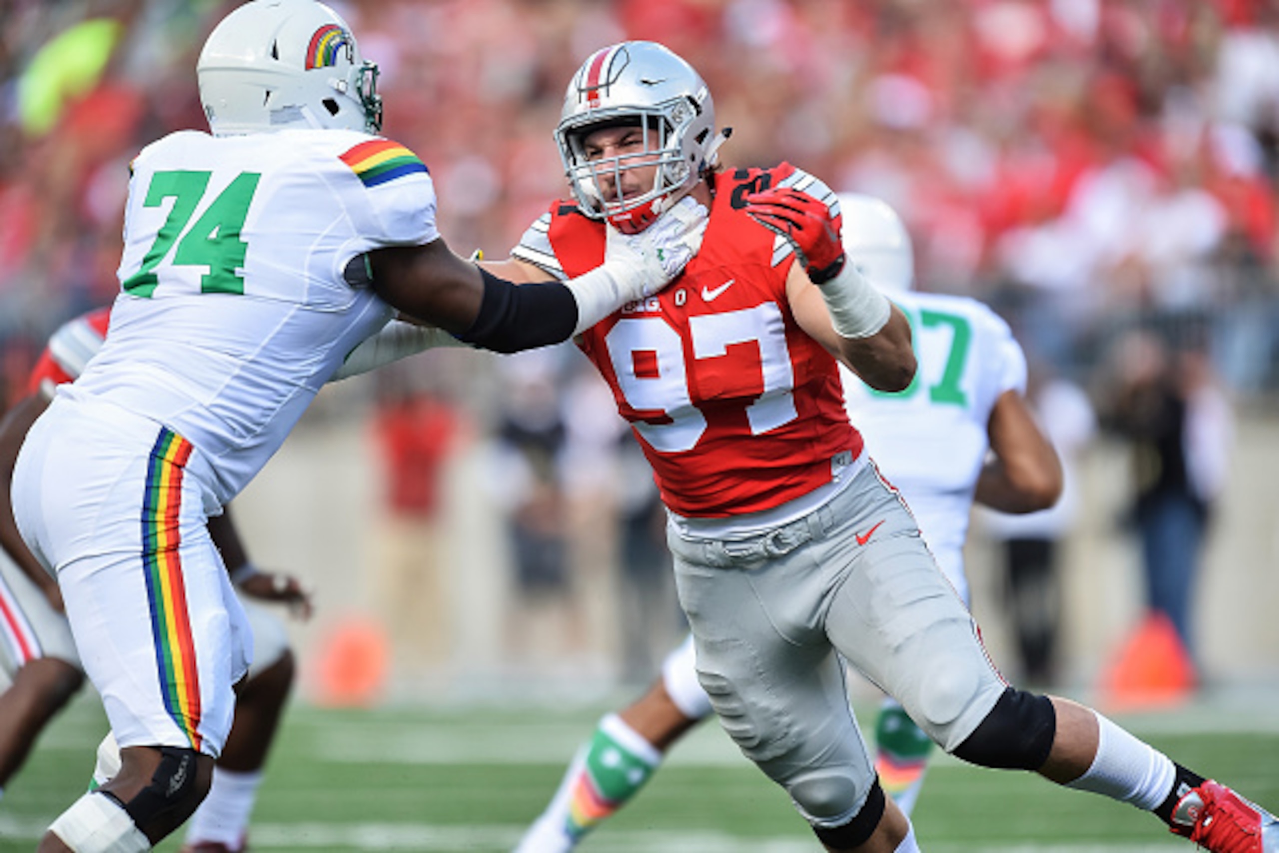 COLUMBUS, OH - SEPTEMBER 12:  Joey Bosa #97 of the Ohio State Buckeyes takes off the line against the Hawaii Rainbow Warriors at Ohio Stadium on September 12, 2015 in Columbus, Ohio.  (Photo by Jamie Sabau/Getty Images)