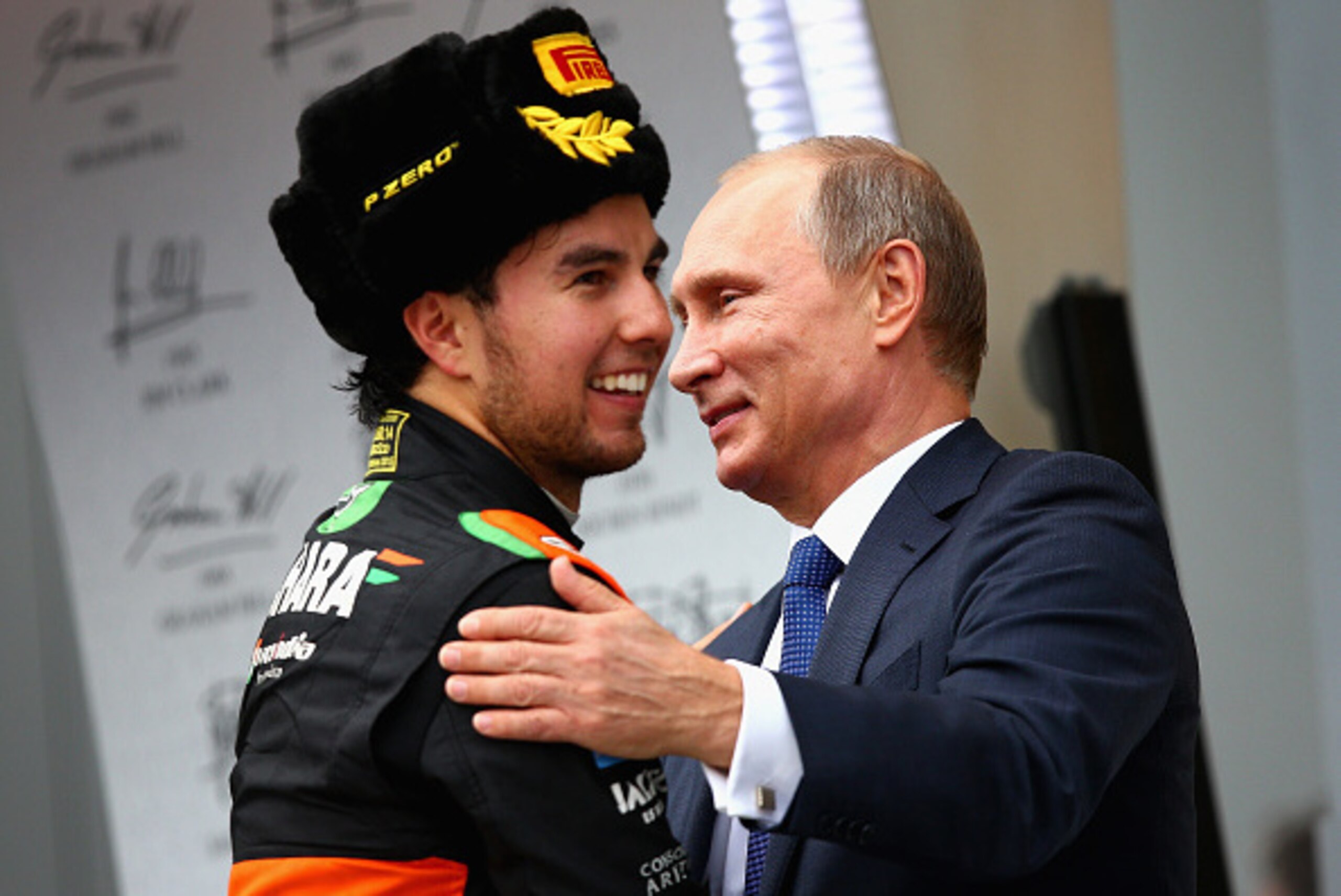 SOCHI, RUSSIA - OCTOBER 11:  Sergio Perez of Mexico and Force India is congratulated by the President of Russia, Vladimir Putin on ythe podium after finishing third in the Formula One Grand Prix of Russia at Sochi Autodrom on October 11, 2015 in Sochi, Ru