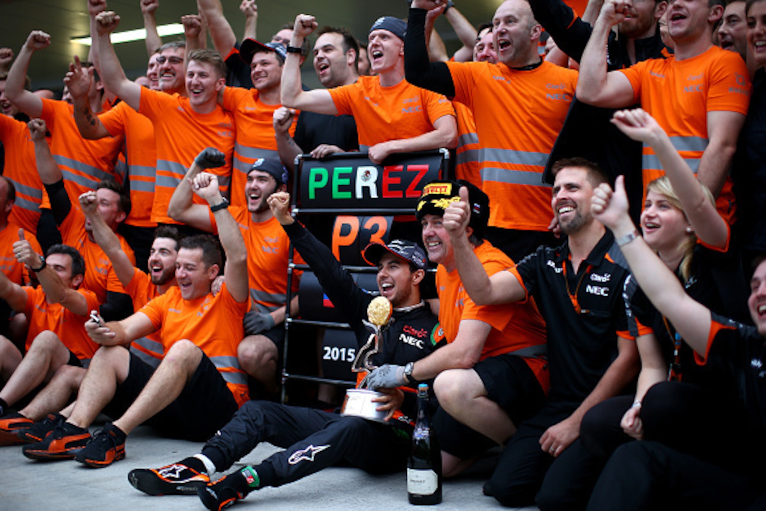 SOCHI, RUSSIA - OCTOBER 11:  Sergio Perez of Mexico and Force India celebrates with his team after finishing third in the Formula One Grand Prix of Russia at Sochi Autodrom on October 11, 2015 in Sochi, Russia.  (Photo by Mark Thompson/Getty Images)