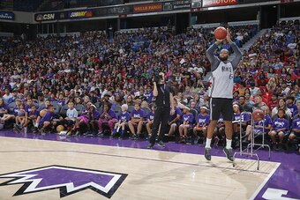 SACRAMENTO, CA - OCTOBER 11:  DeMarcus Cousins #15 of the Sacramento Kings participates in the 3 point contest during the Sacramento Kings Fan Fest on October 11, 2015 at Sleep Train Arena in Sacramento, California. NOTE TO USER: User expressly acknowledg