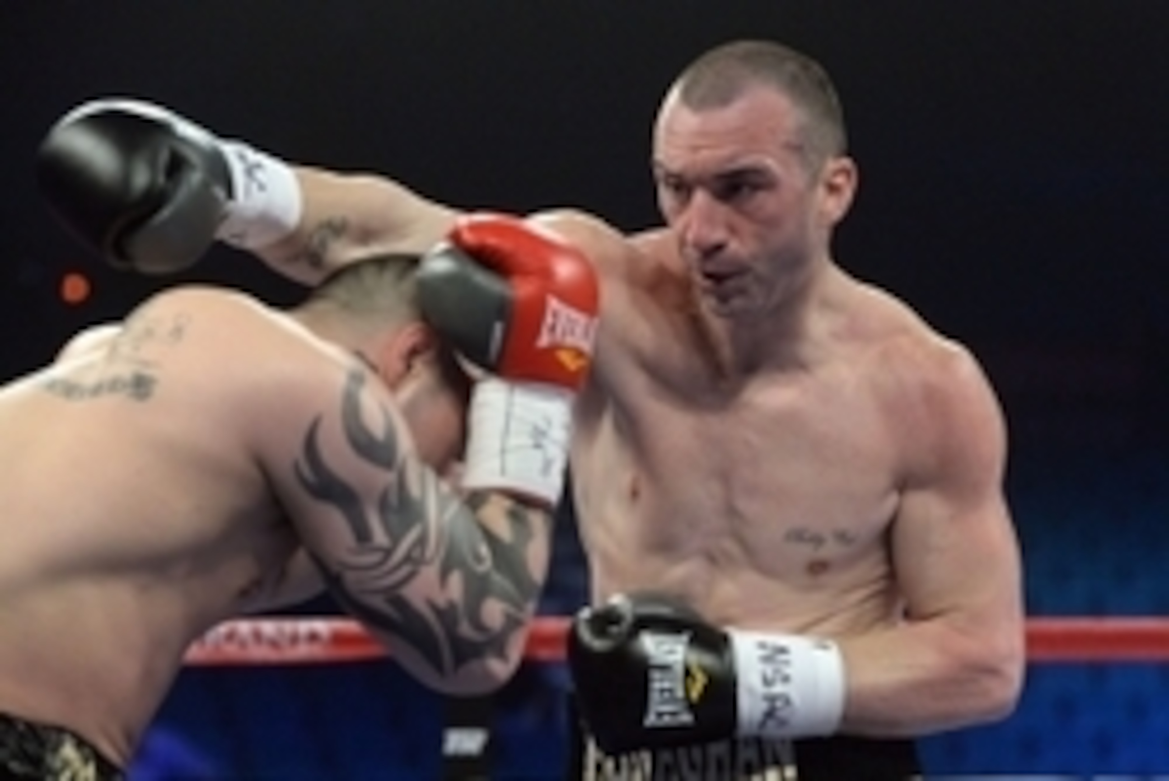 Apr 12, 2014; Las Vegas, NV, USA; Sean Monaghan (black gloves) and Joe McCreedy (red gloves) during their WBC Continental Americas Light Heavyweight title fight at the MGM Grand Garden Arena. Mandatory Monaghan won. Credit: Jayne Kamin-Oncea-USA TODAY Spo
