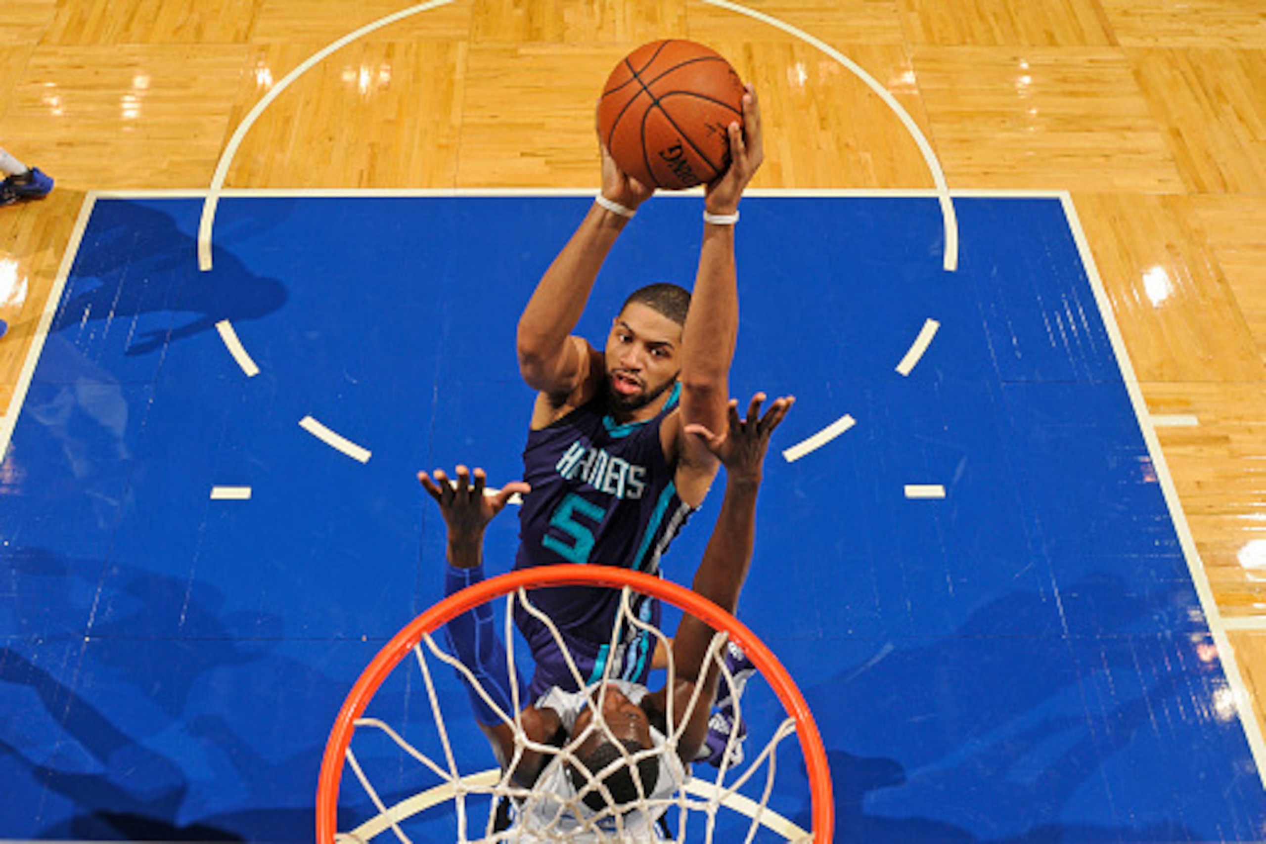 ORLANDO, FL - OCTOBER 3:  Nicolas Batum #5 of the Charlotte Hornets shoots the ball against the Orlando Magic during a preseason game on October 3, 2015 at Amway Center in Orlando, Florida. NOTE TO USER: User expressly acknowledges and agrees that, by dow