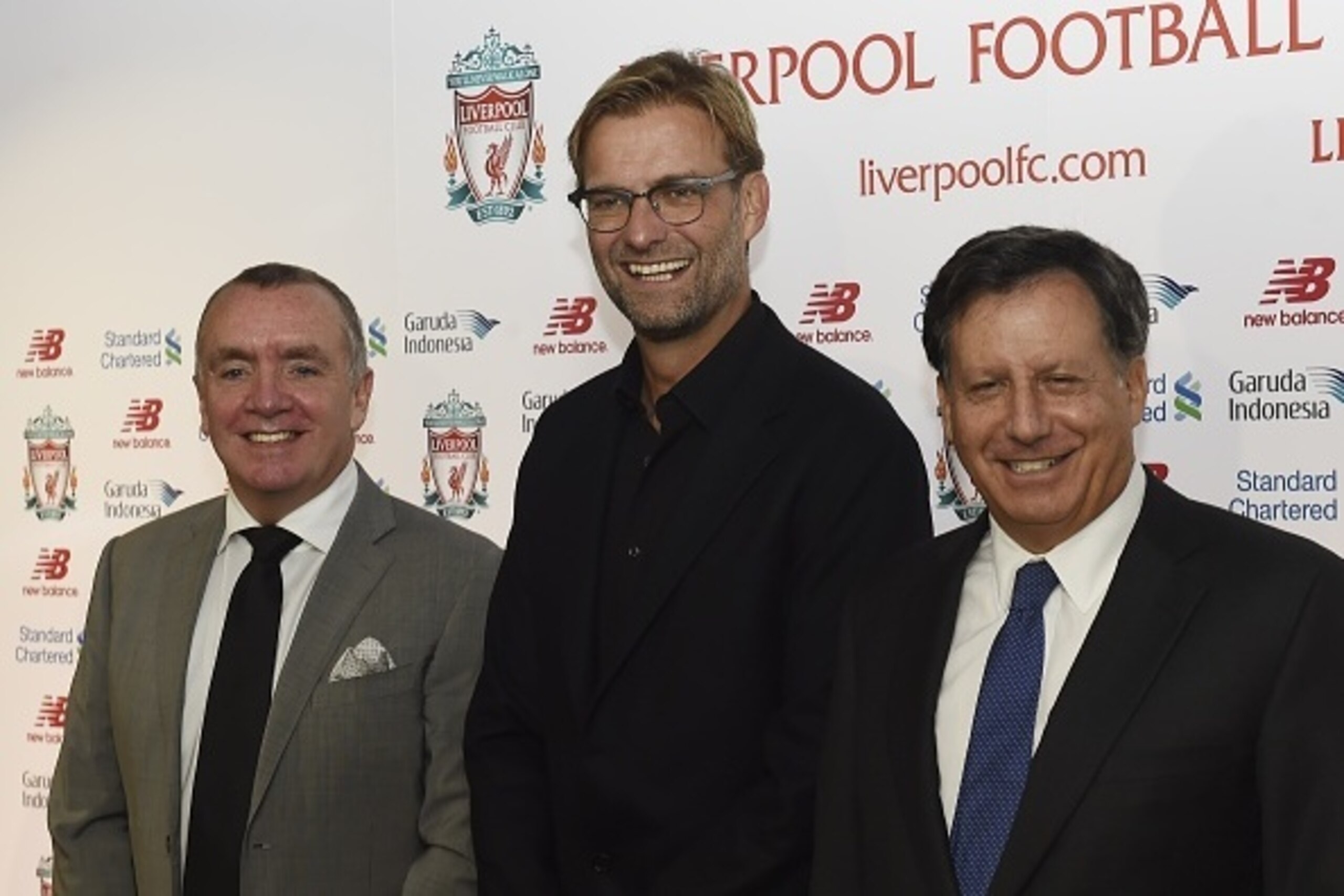 Liverpool's new German manager Jurgen Klopp (C) poses with Liverpool's managing director Ian Ayre (L) and chairman Tom Werner (R) at the start of a press conference to announce Klopp's appointment at Anfield in Liverpool, northwest England, on October 9, 