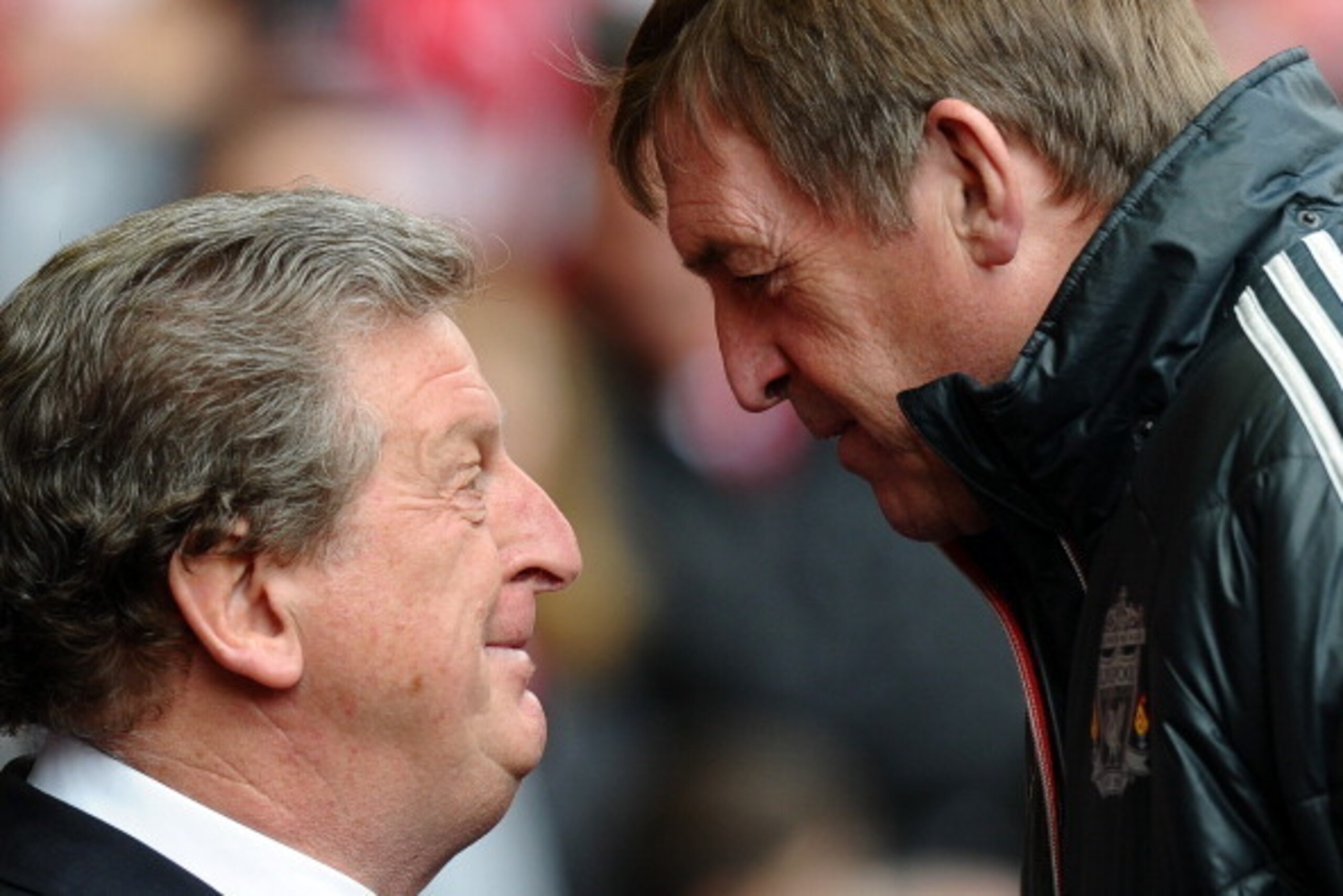 Liverpool 's Scottish manager Kenny Dalglish (R) and West Bromwich Albion's English manager Roy Hodgson speak before the English Premier League football match between Liverpool and West Bromwich Albion at Anfield in Liverpool, north-west England on April 